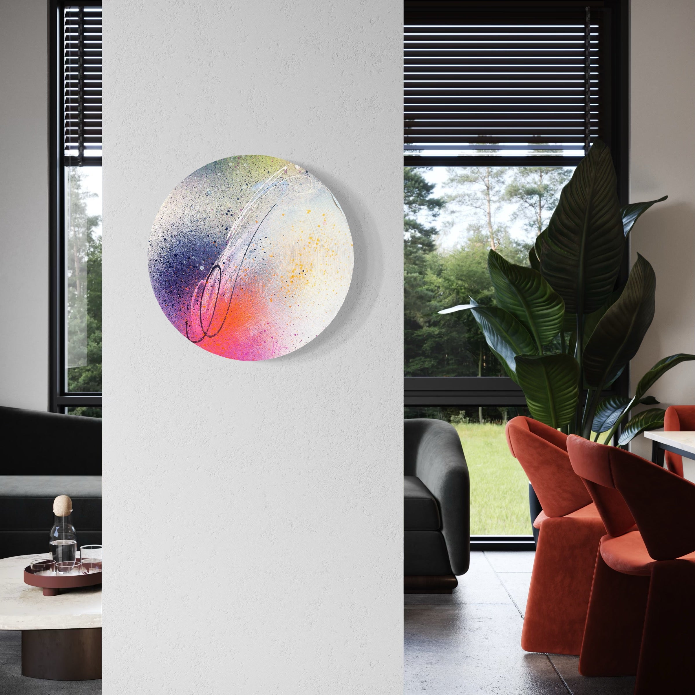 We Only Ever Have Now" by Kate Mayer on a white wall, set between living and dining rooms with large windows framing greenery.