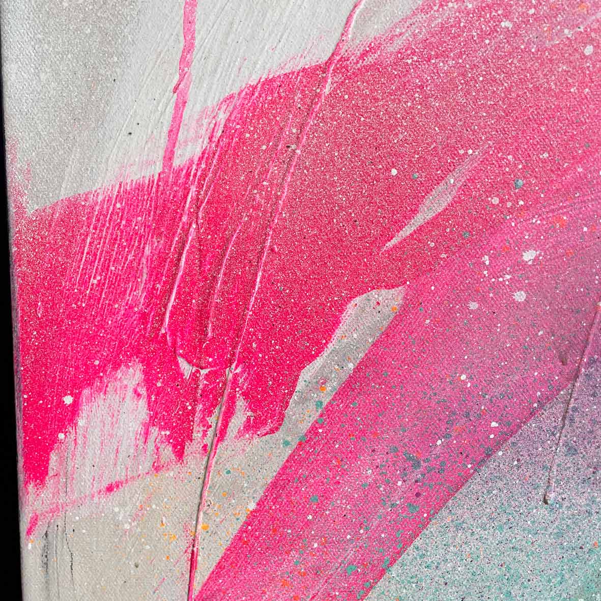 The product named "Never Too Much - Original Painting" by Kate Mayer showcases an abstract design with vibrant pink brush strokes and splatters, crafted using acrylic and spray paint on a textured gray canvas.