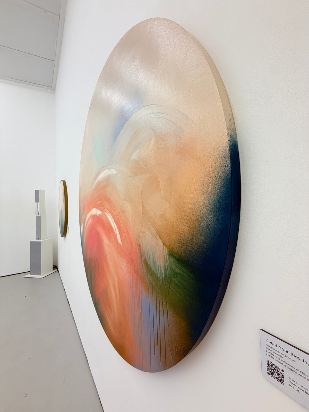 Count Your Blessings by Kate Mayer: acrylic on plywood, pastel swirls; metal float frame shown on gallery wall.