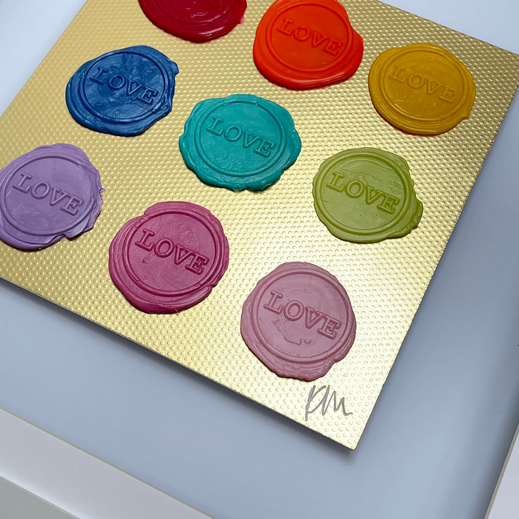 Sealed Intention - Love is Love" by Kate Mayer: nine colorful wax seals, perfect original art for wall display.