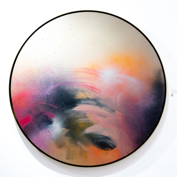 A Star is Born by Kate Mayer, a circular abstract painting, adorns the wall in a bespoke handmade metal float frame.