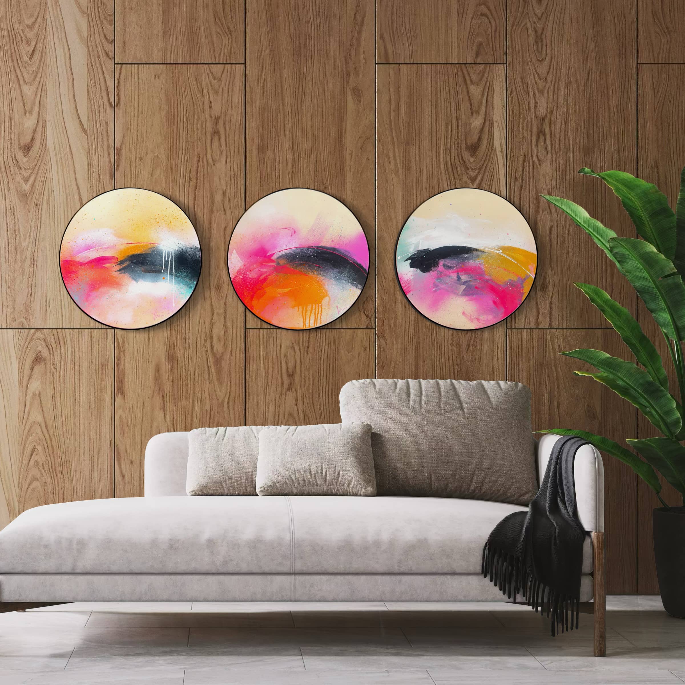 Modern living room with a grey sofa, large plant, and Move On Up by Kate Mayer on a circular plywood panel.