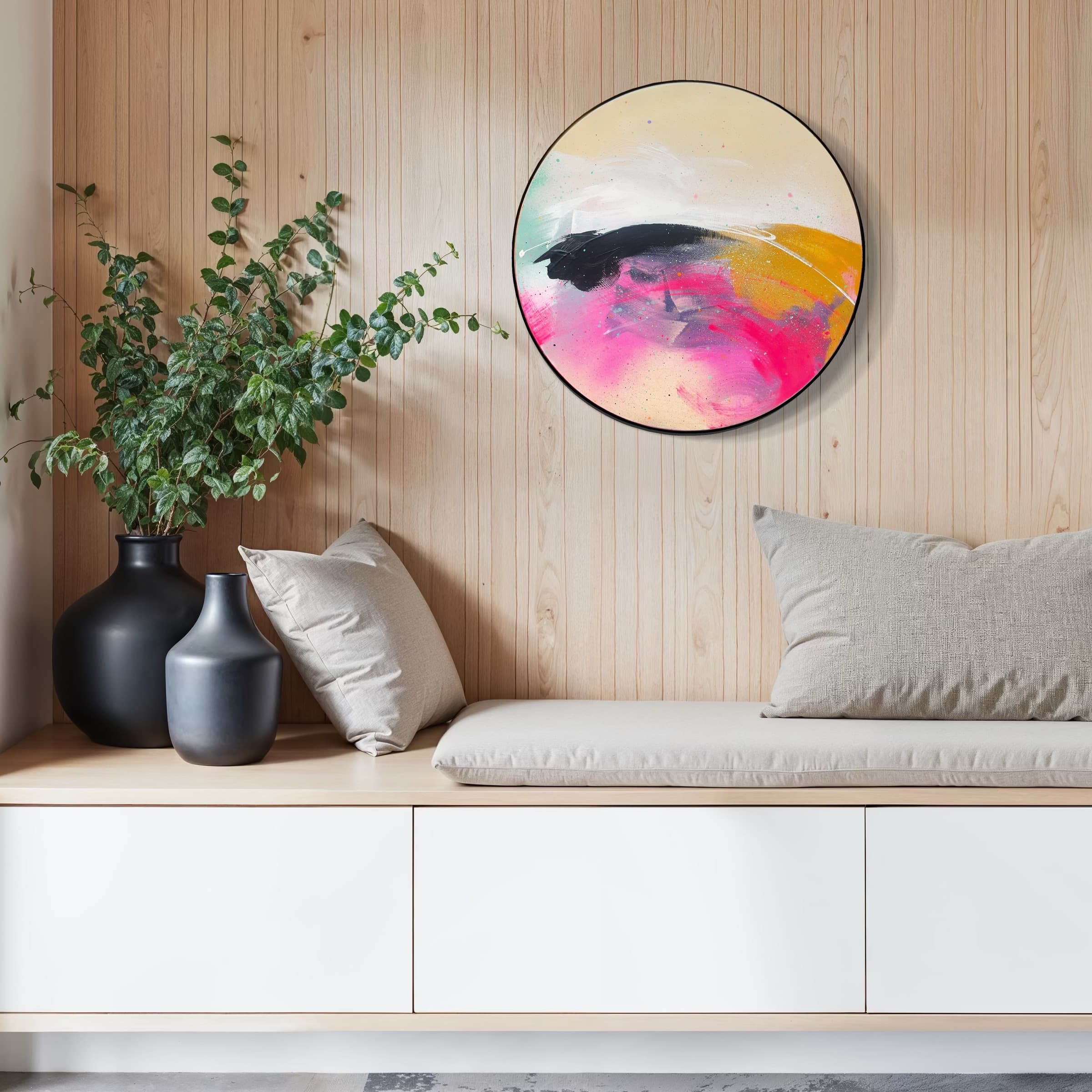 Bench with gray cushions, black vases with greenery, and Move On Up by Kate Mayer on a light wood-paneled wall.