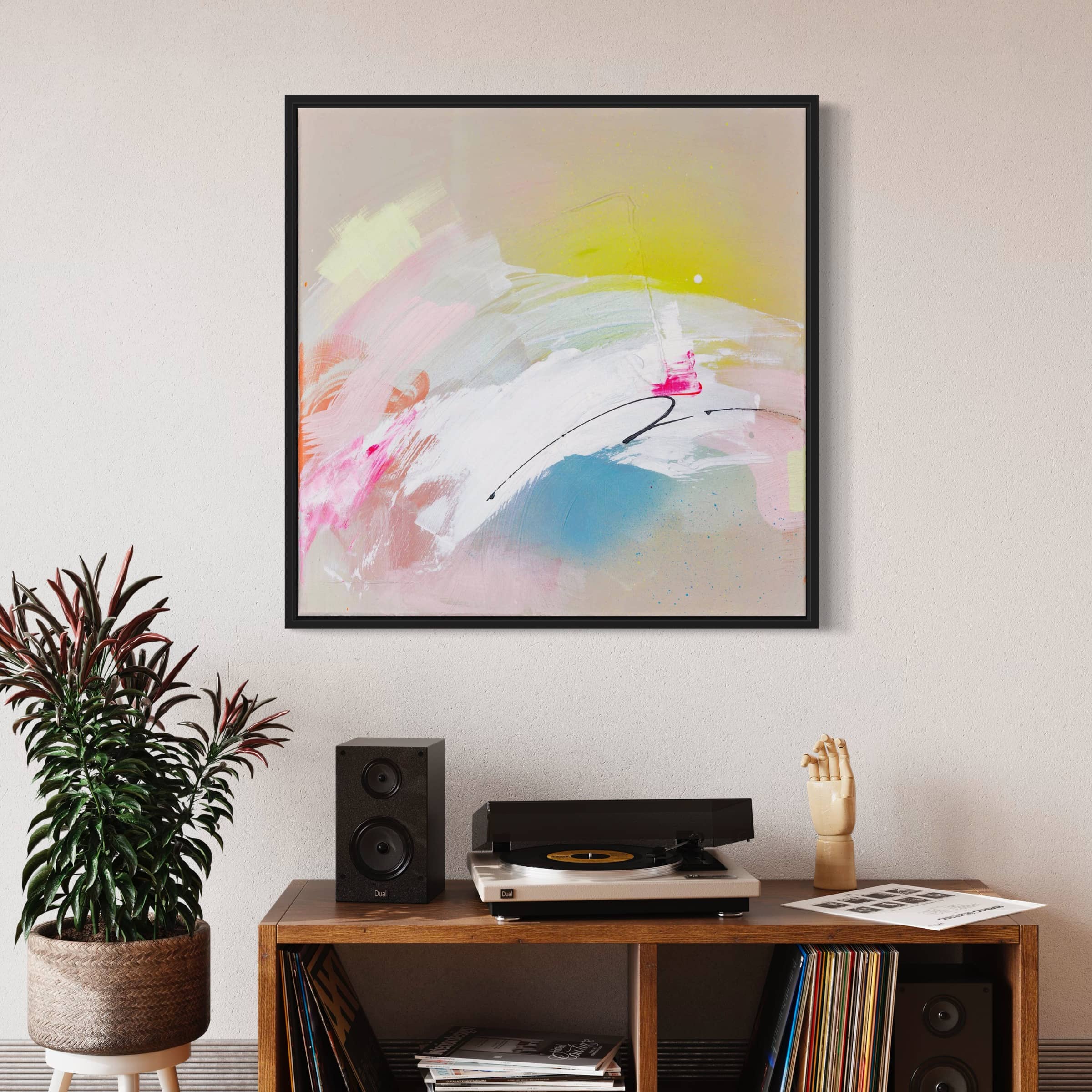 A modern living room features the "Miami Beach" original painting by Kate Mayer, a vinyl record player, speakers, a plant, and a decorative hand displayed on a wooden shelf.