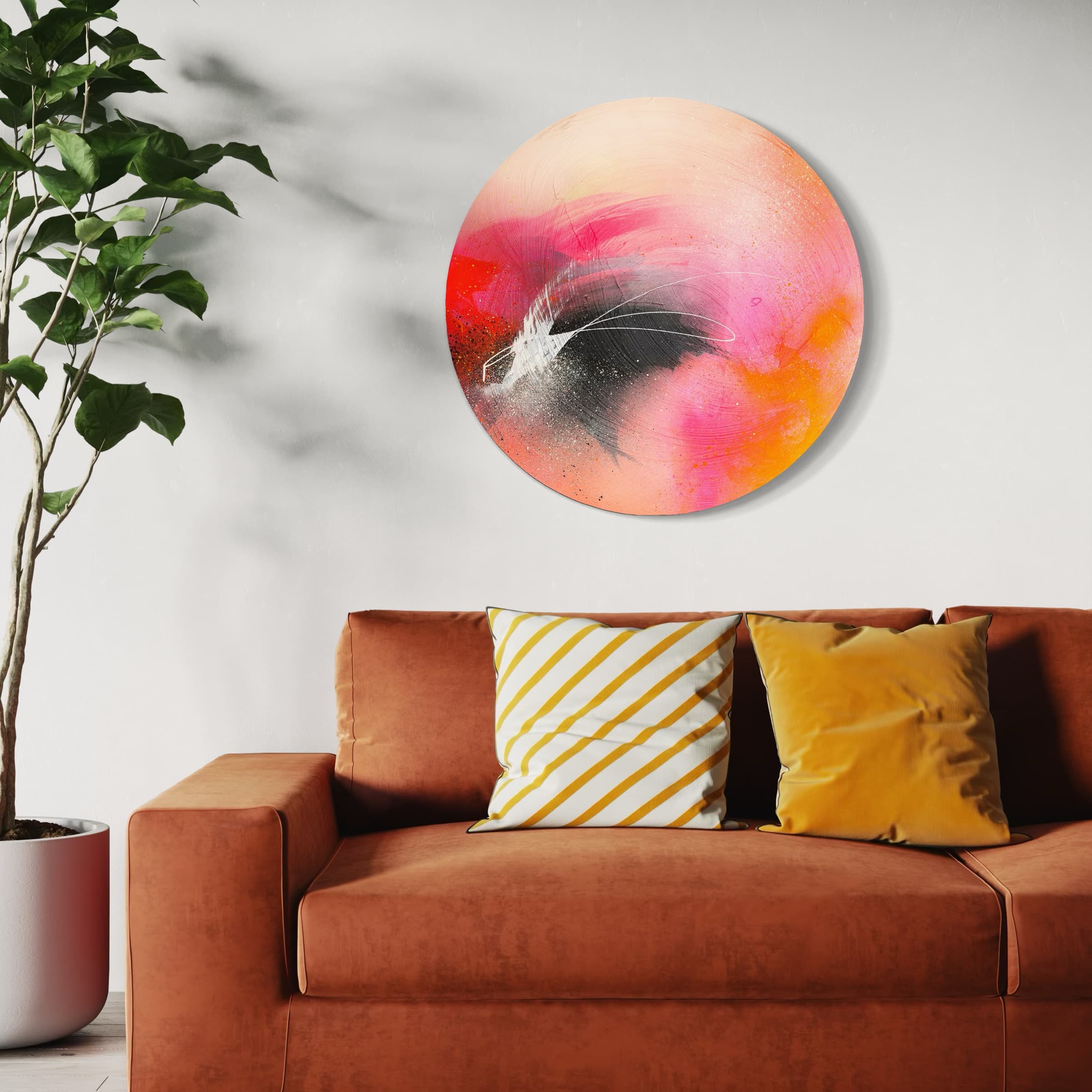 Modern living room with orange sofa, yellow pillows, Kate Mayer's "Set The World On Fire" painting, and a green plant.
