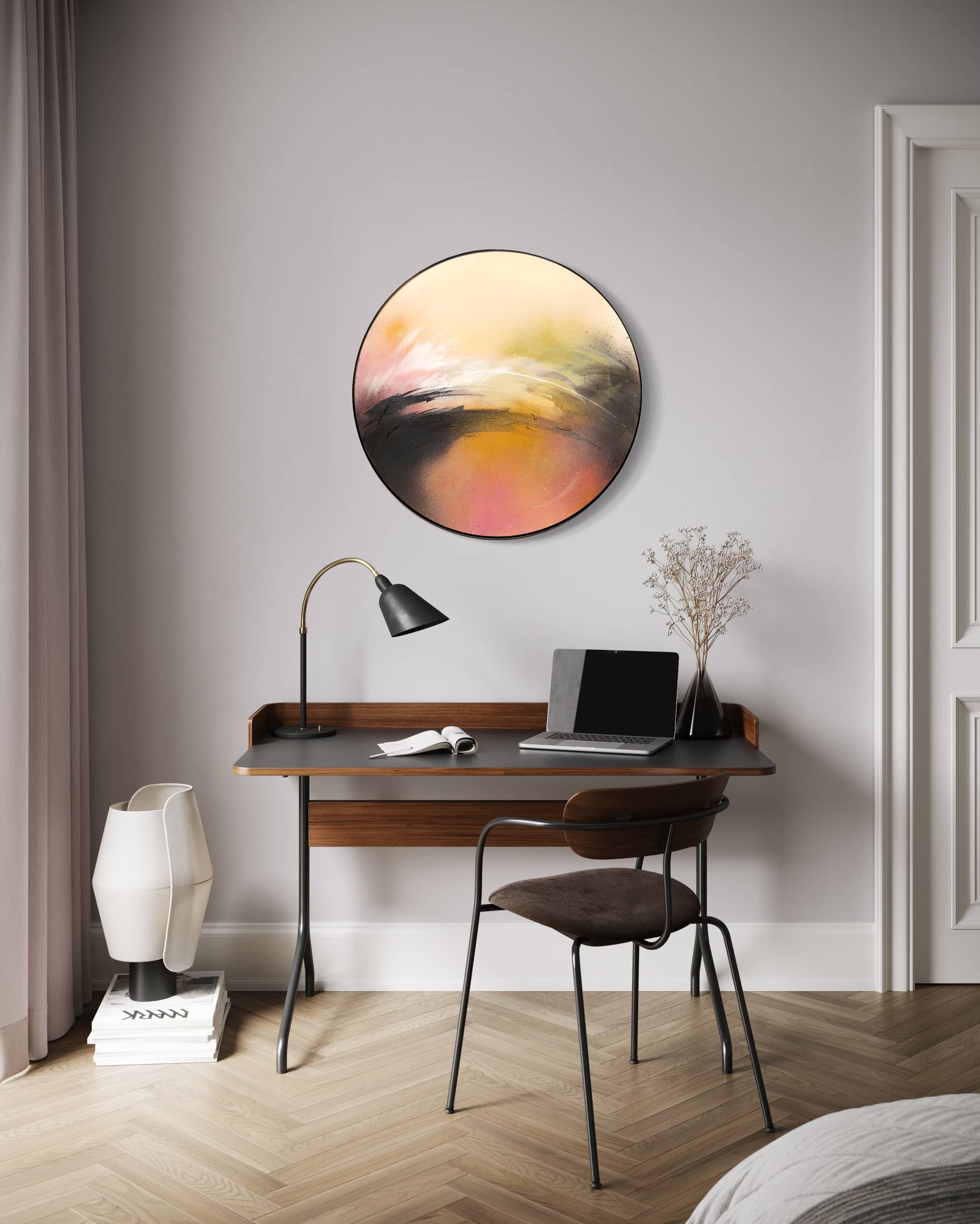 Minimalist home office with a small desk, laptop, lamp, and "One Day Like This" art by Kate Mayer on a light gray wall.