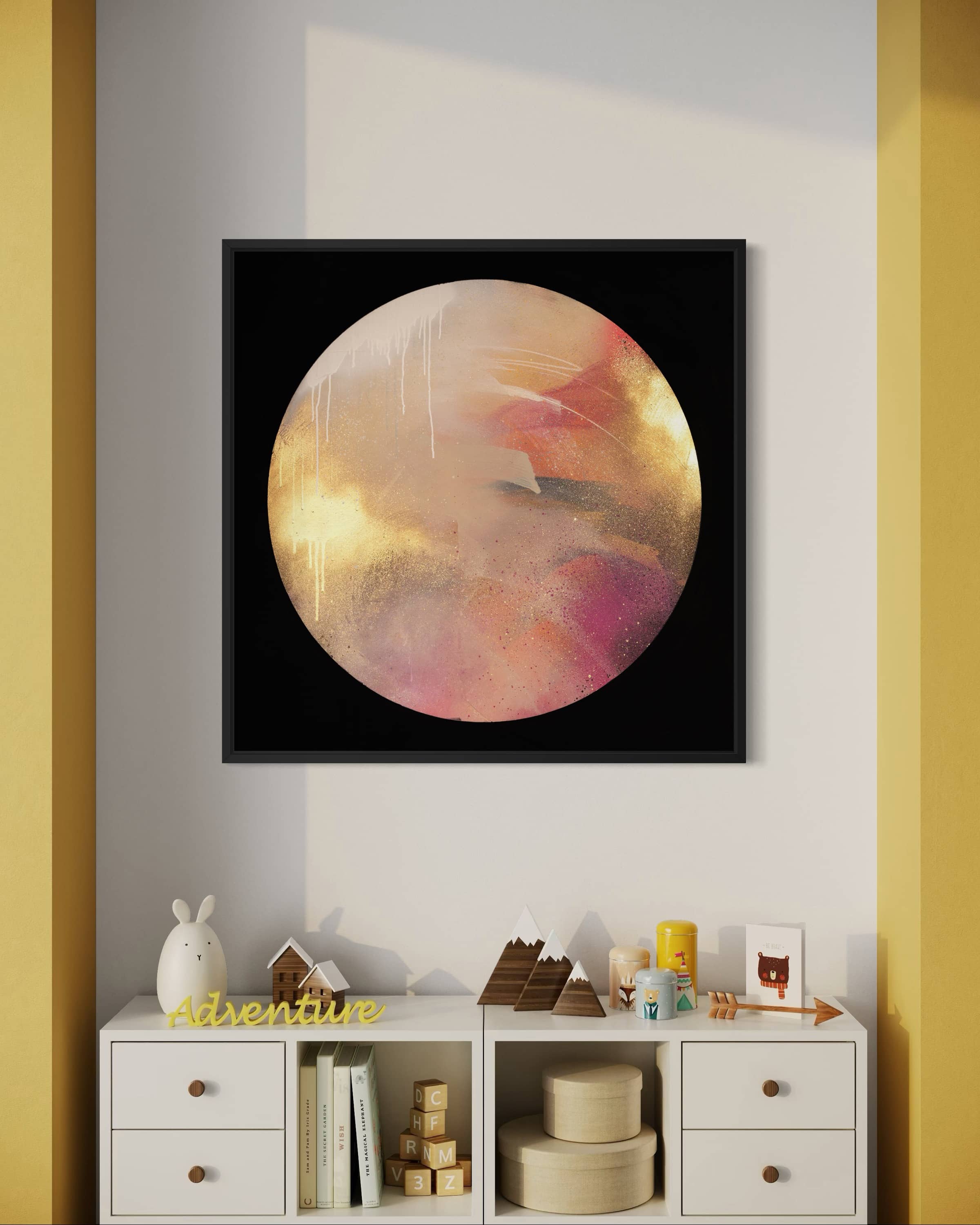 The "Where Love Lives" by Kate Mayer hangs above a white dresser with toys in a cozy kids' room.
