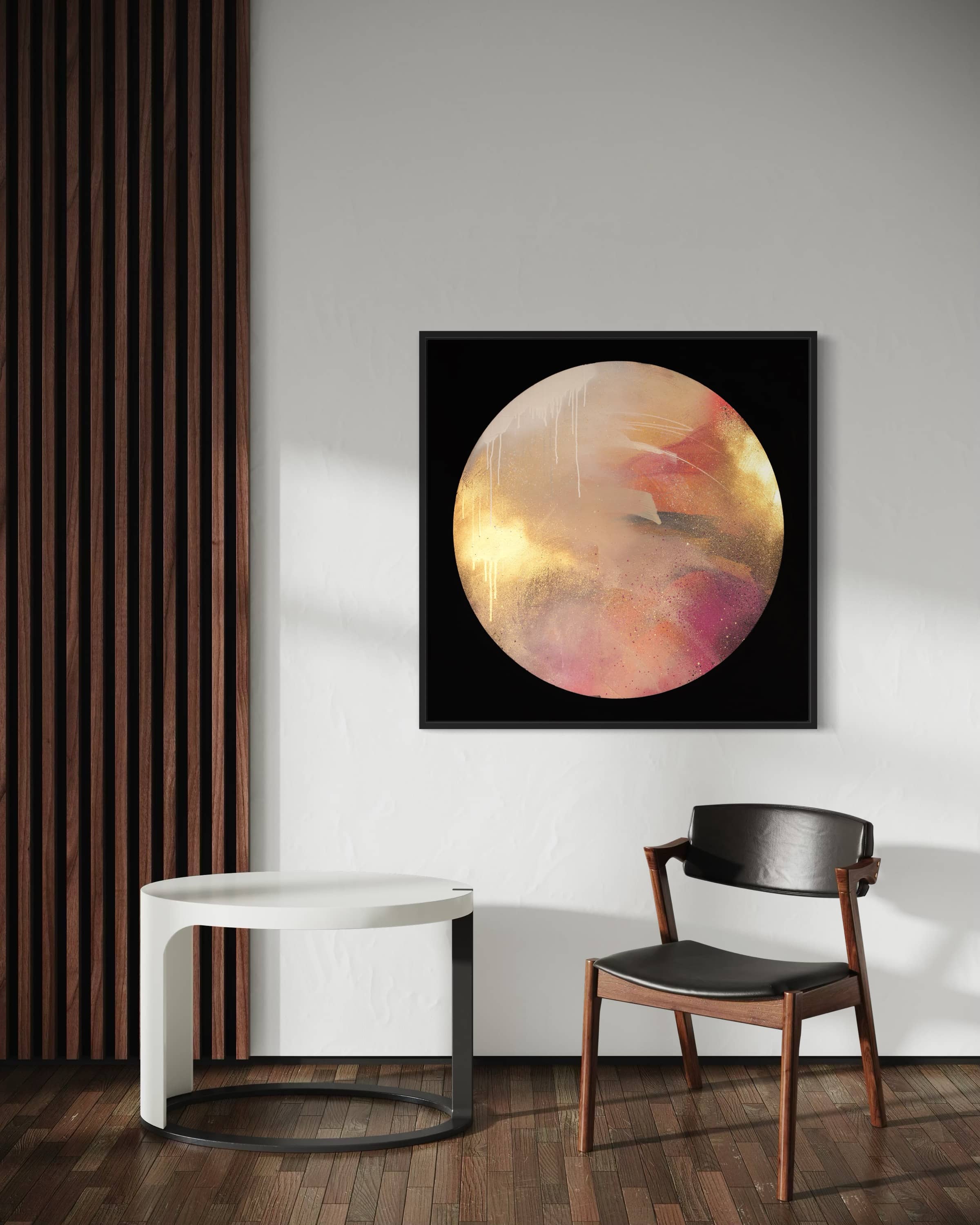 Modern room with a black chair, white table, and "Where Love Lives" by Kate Mayer on paneled walls.