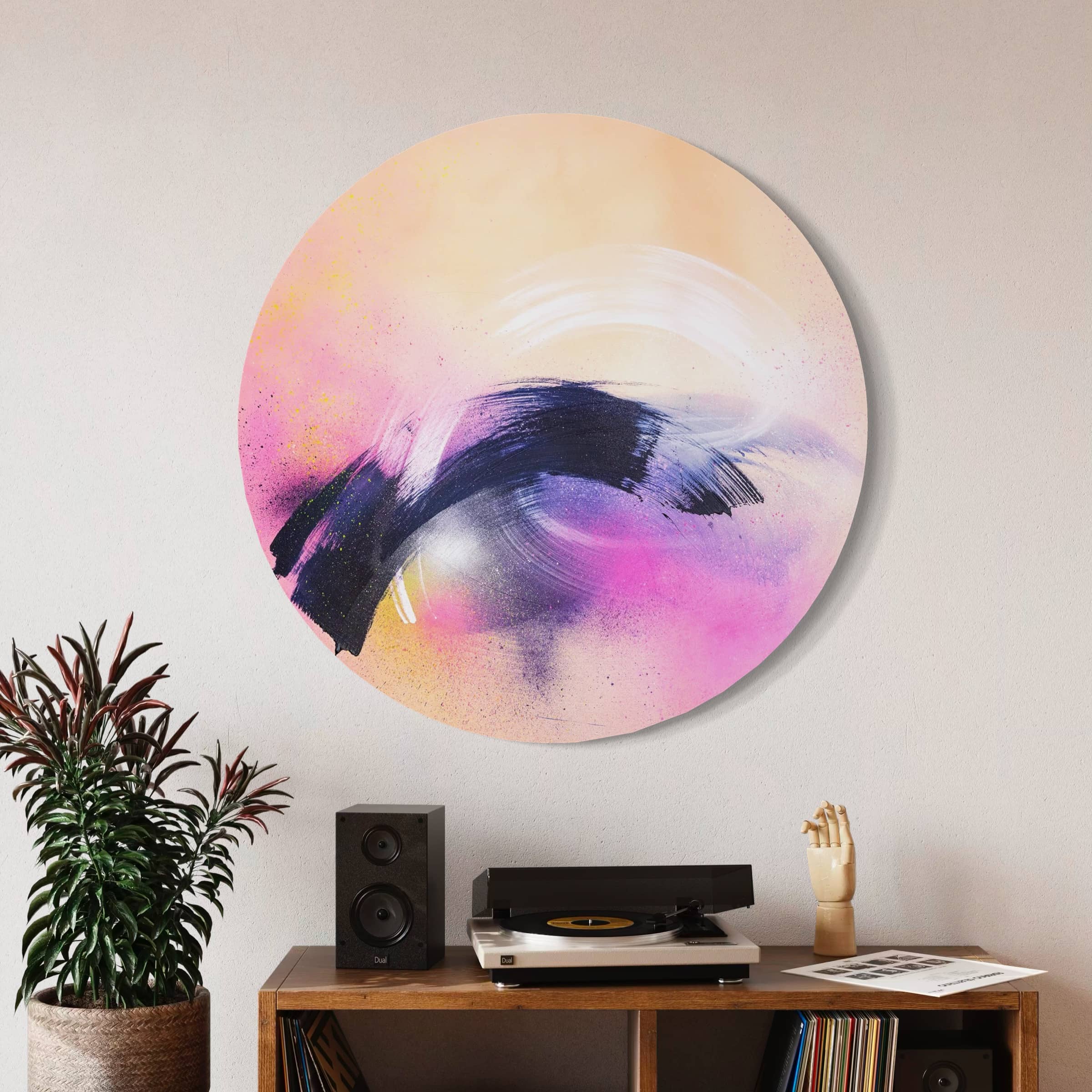 Breathe In The Air by Kate Mayer, an abstract acrylic on circular panel, adorns the wall above a record player.