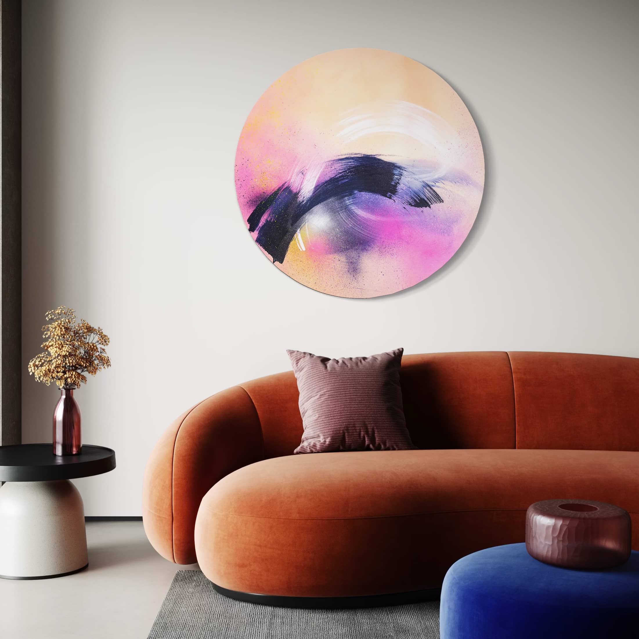 A modern living room with Kate Mayer's "Breathe In The Air" abstract painting in a handmade metal float frame and an orange sofa.