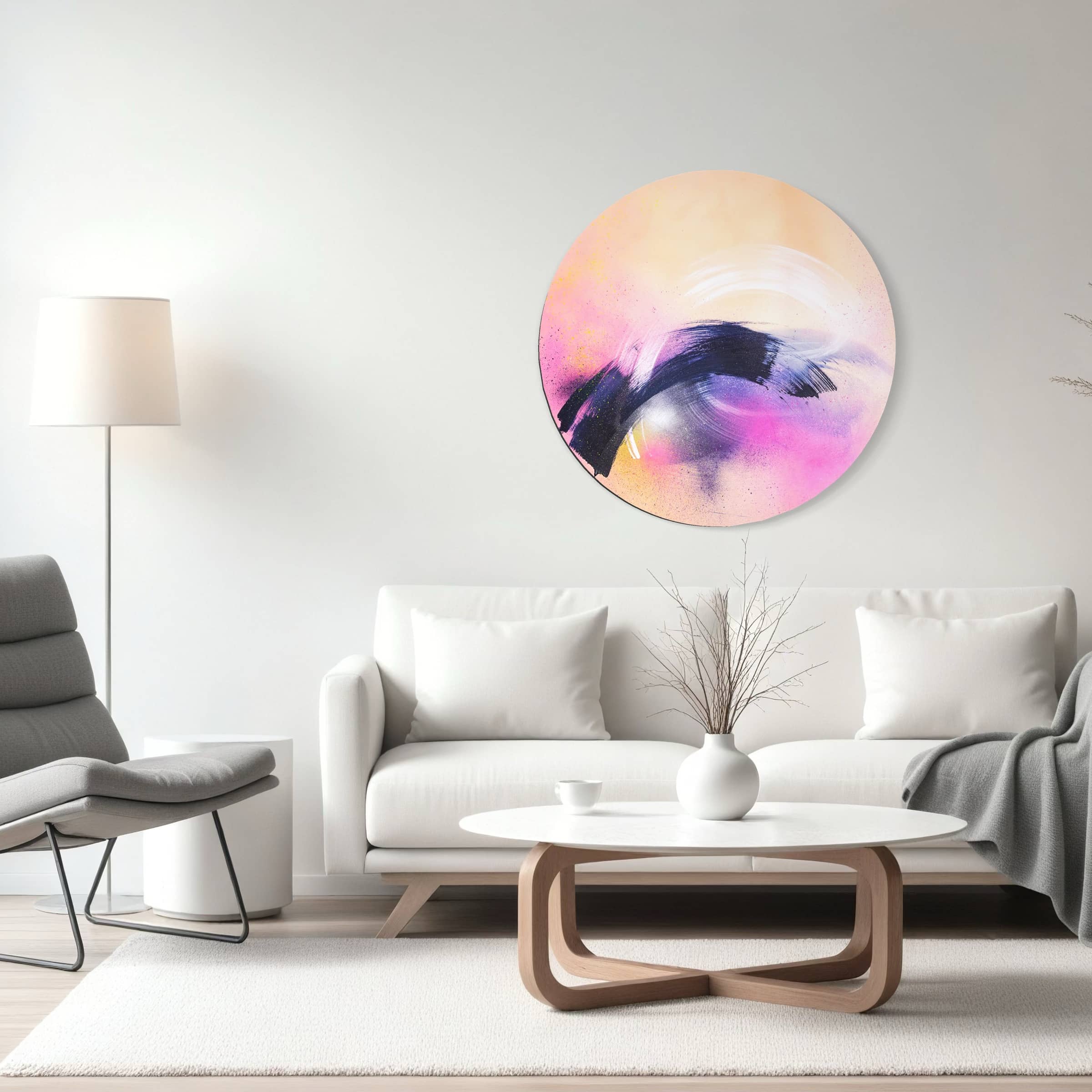 A modern living room with a white sofa, round coffee table, and "Breathe In The Air" painting by Kate Mayer on metal float frame.