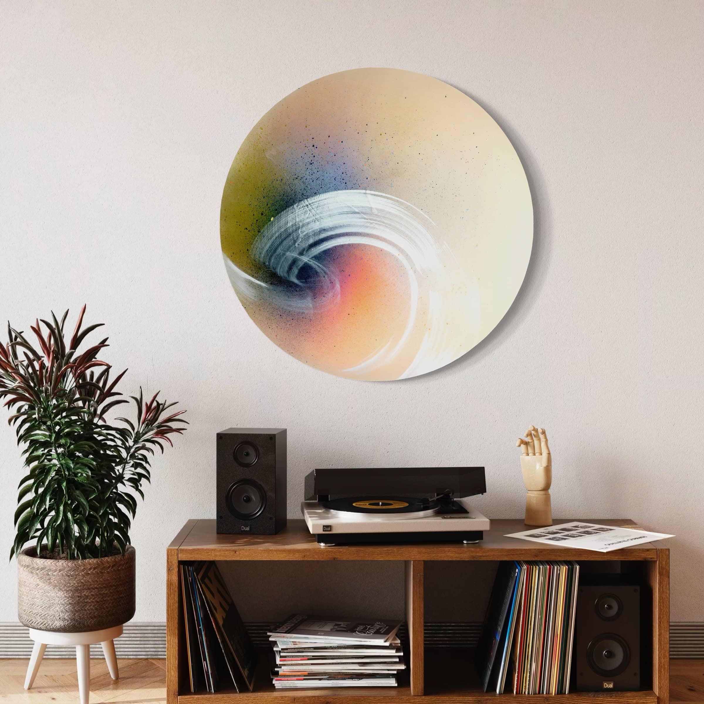 A room with Kate Mayer's "From Here To Infinity" painting, a shelf with speakers, record player, and potted plant.