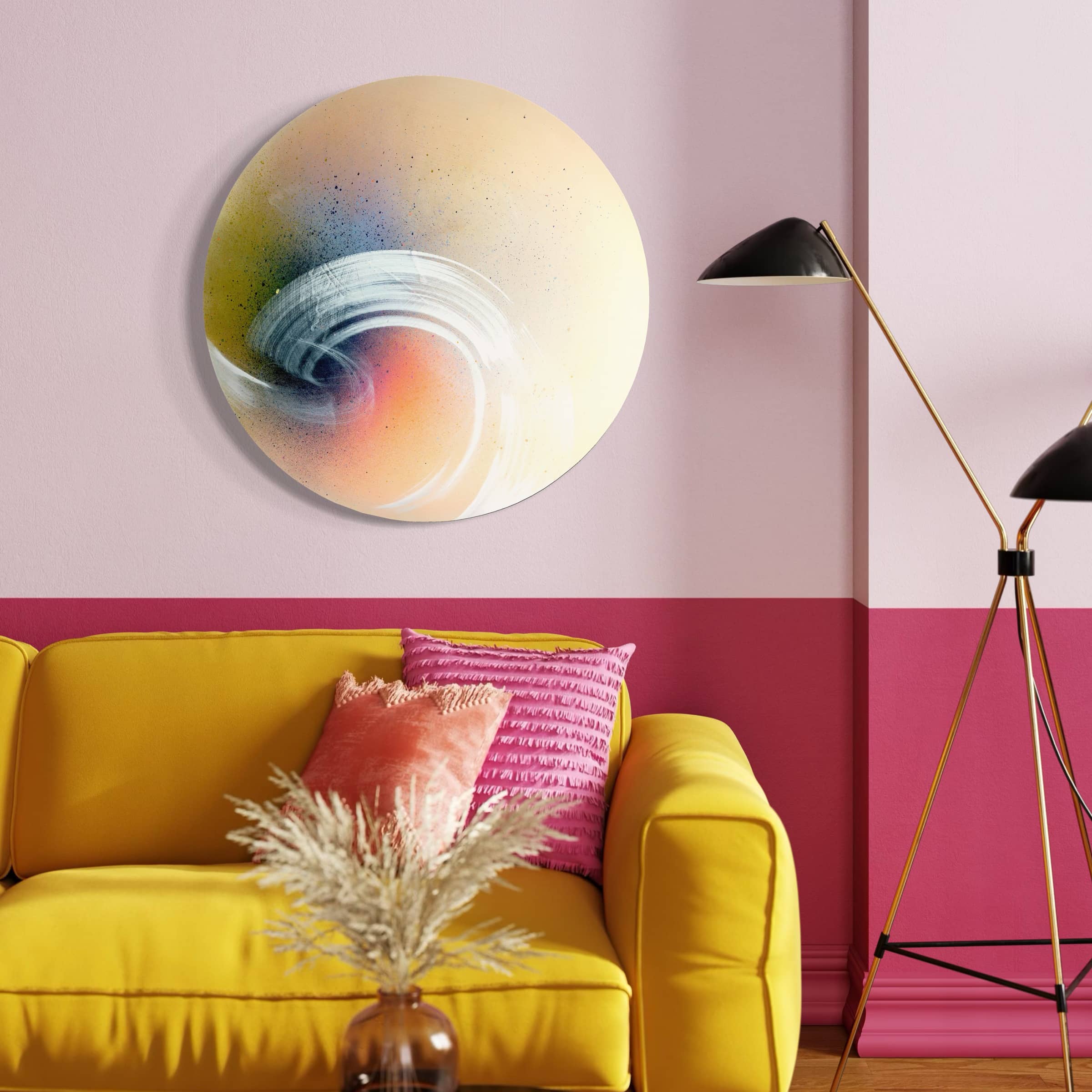A vibrant room with a yellow sofa, pink pillows, and Kate Mayer's "From Here To Infinity" abstract painting above.