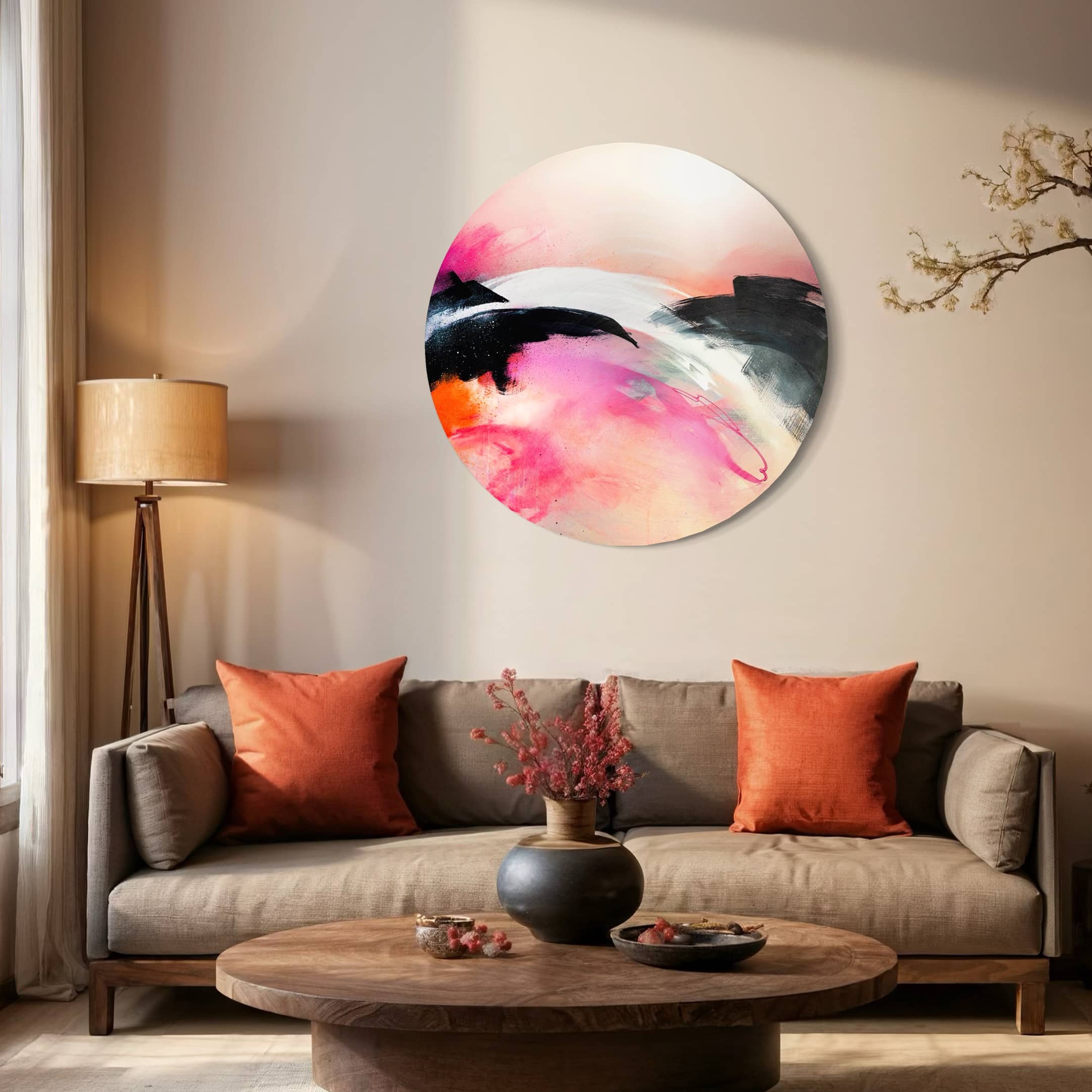 A cozy living room with a gray sofa, orange cushions, and Kate Mayer's "It's A New Dawn" abstract metal-framed painting.