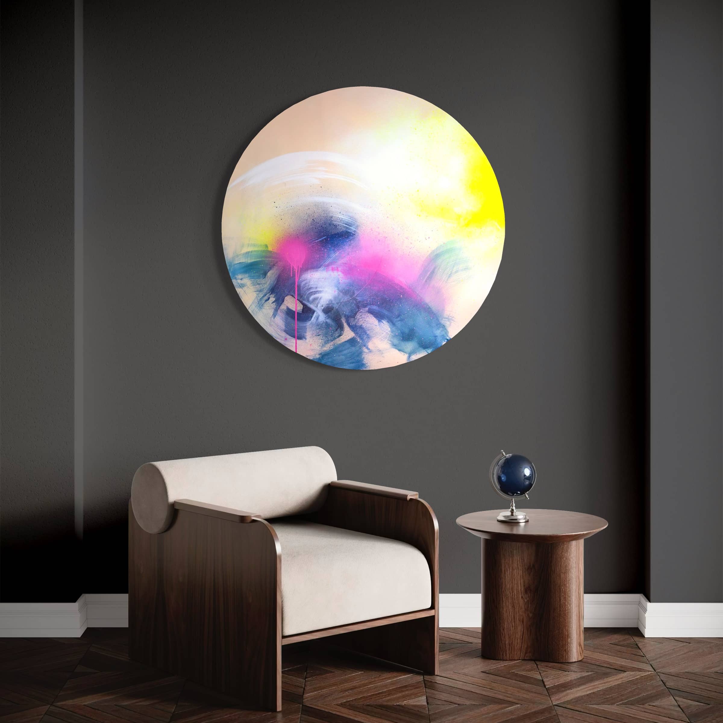 Minimalist room with a beige chair, round wooden table, and "Rolling In The Deep" painting by Kate Mayer in a handmade frame.