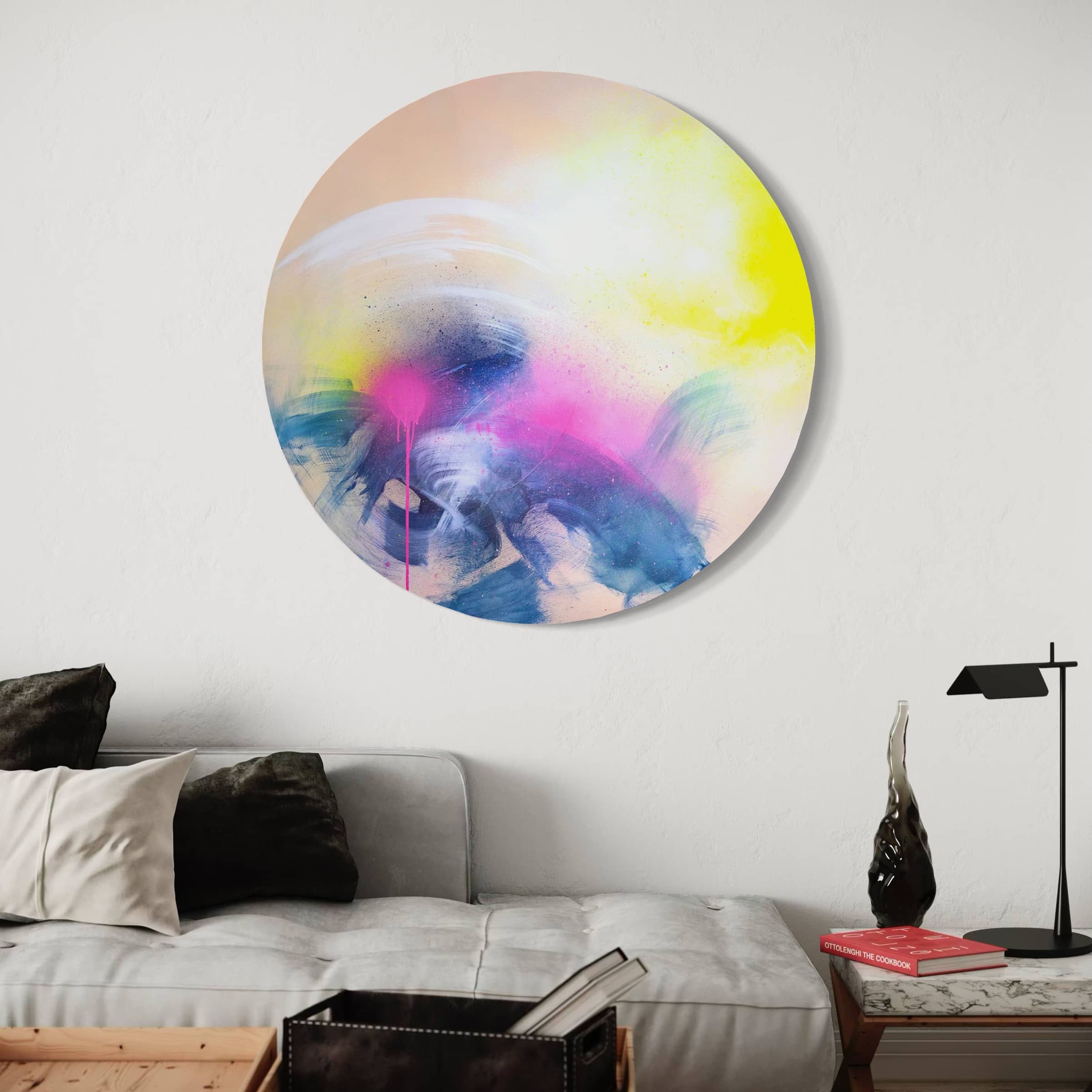 Rolling In The Deep" by Kate Mayer features splashes of pink, yellow, blue, and white above a modern sofa with a bespoke frame.