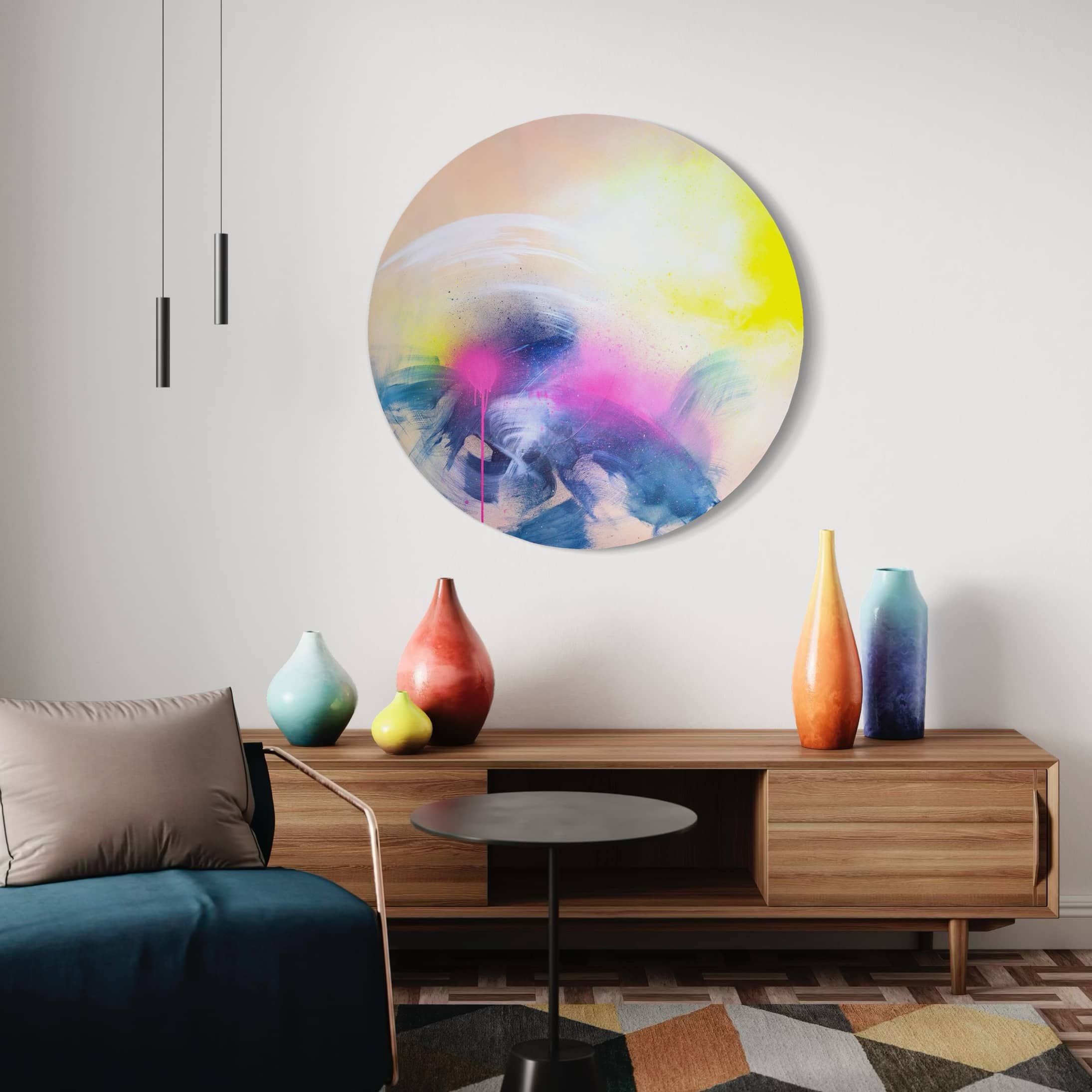 Kate Mayer's "Rolling In The Deep" painting hangs above a wooden sideboard, next to ceramic vases and a black round table.