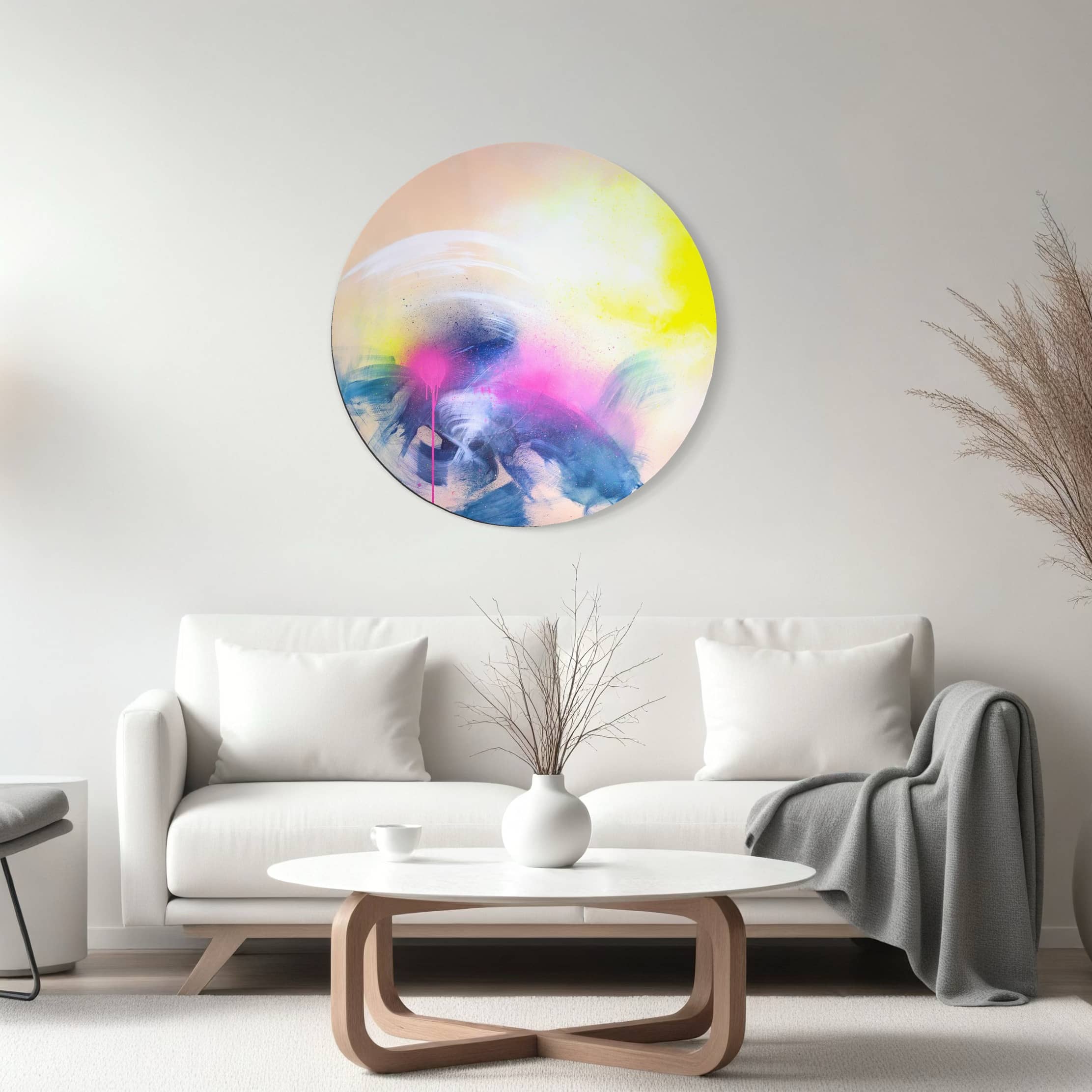 A modern living room with a white sofa, round coffee table, and Kate Mayer's "Rolling In The Deep" in a bespoke handmade frame.