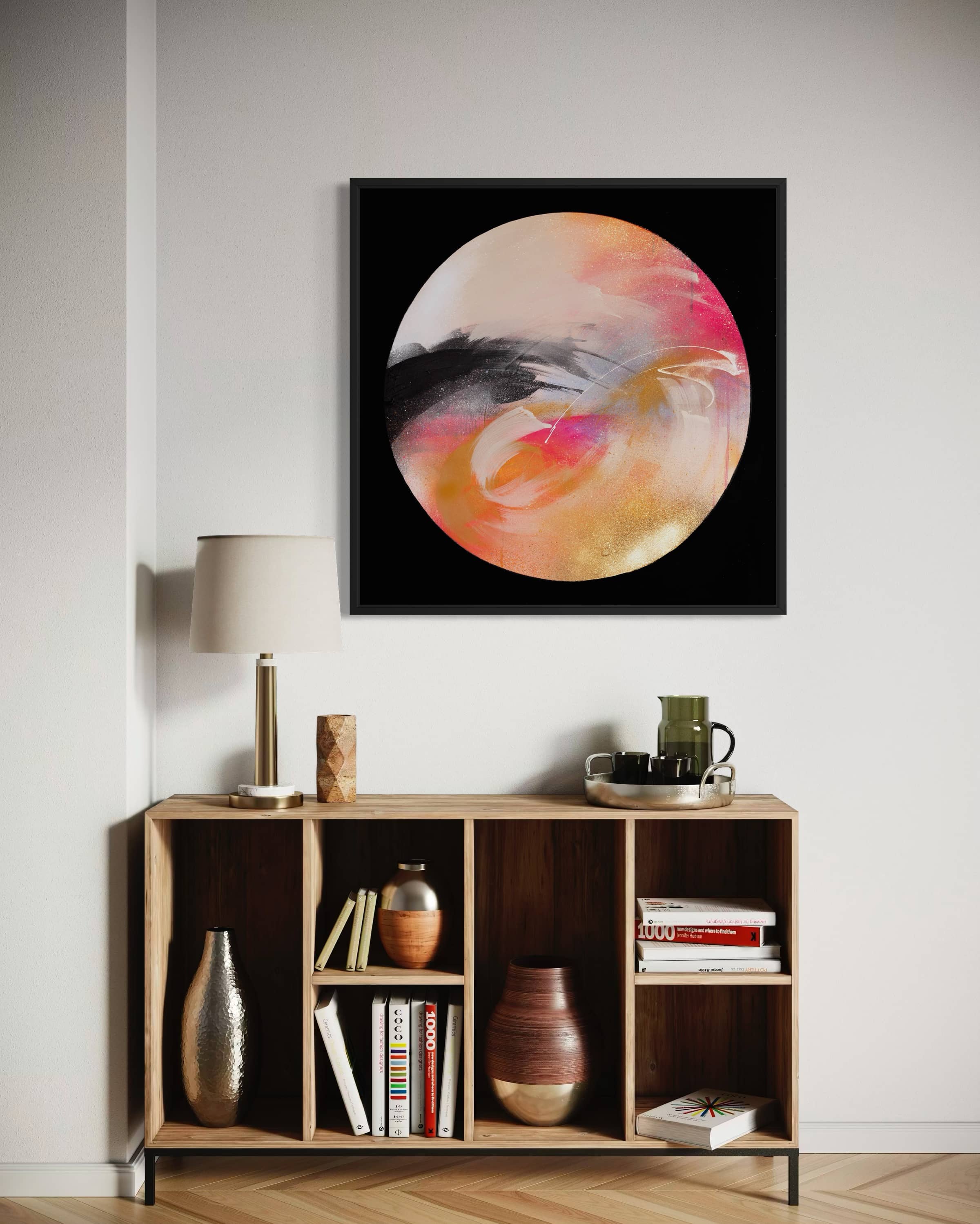 Modern living room featuring "Passion," an acrylic on canvas by Kate Mayer, displayed above a wooden shelf with decor.