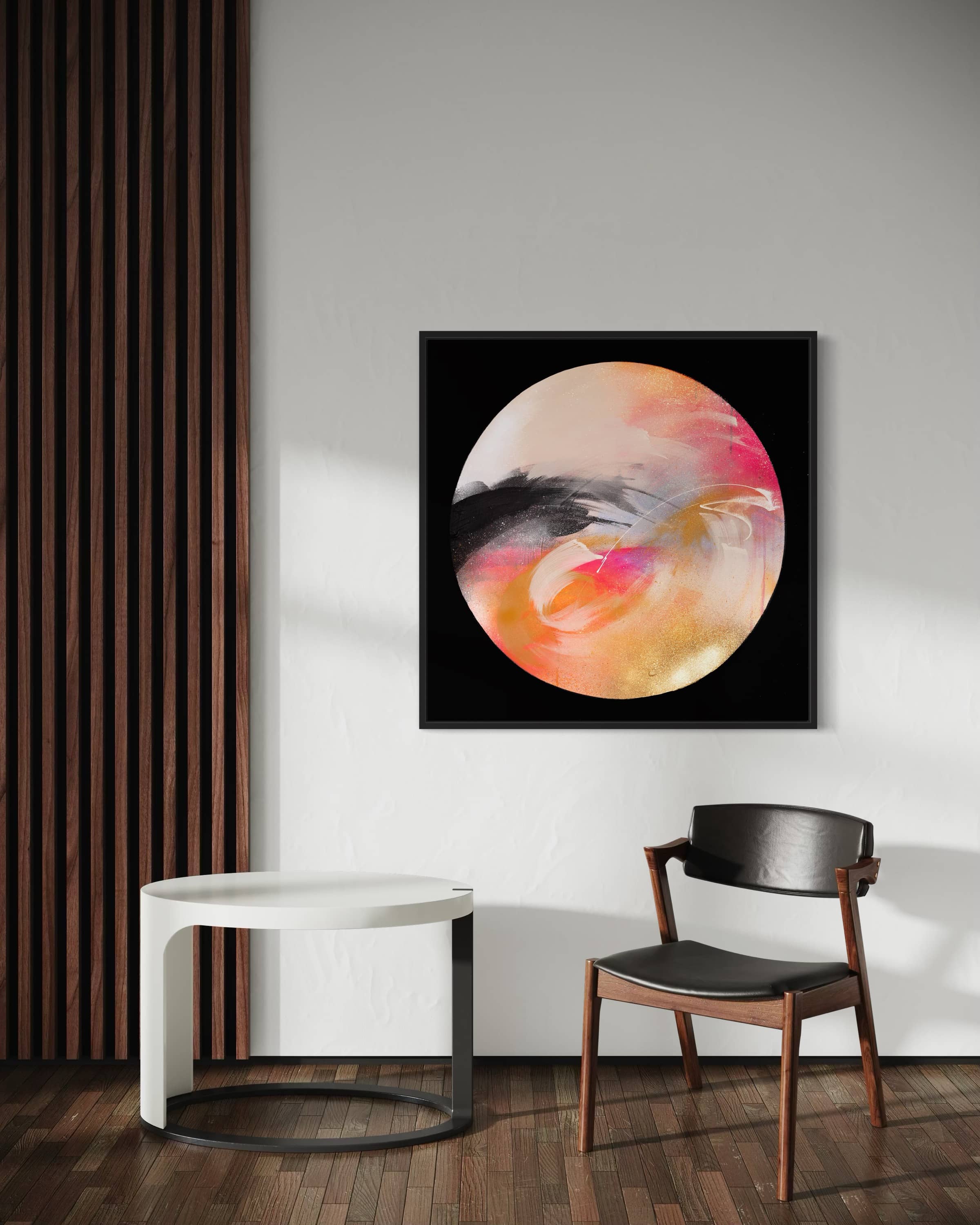 “Passion” by Kate Mayer, an abstract acrylic painting, is displayed above a modern chair and table in this stylish room.