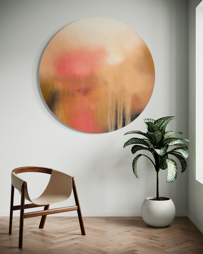 The Afterglow of Awe by Kate Mayer: round acrylic on plywood in a handmade metal frame, displayed above a modern chair.