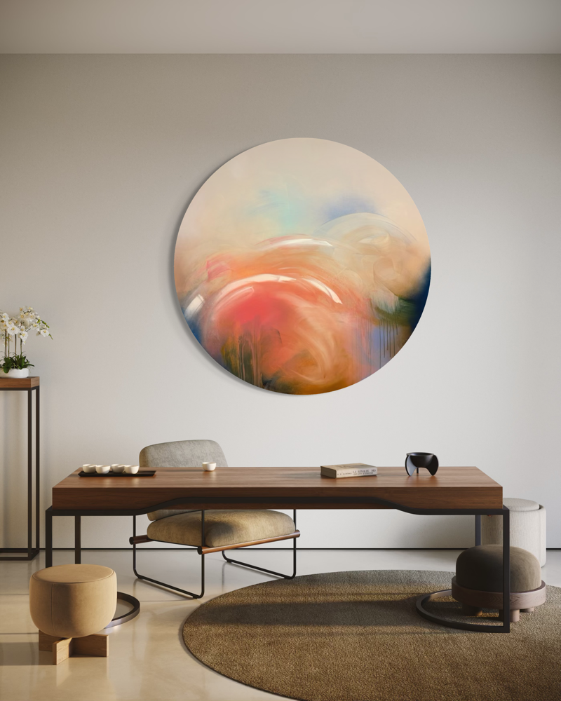 Modern living room with “Count Your Blessings” by Kate Mayer in a metal float frame, wooden desk, and neutral decor.
