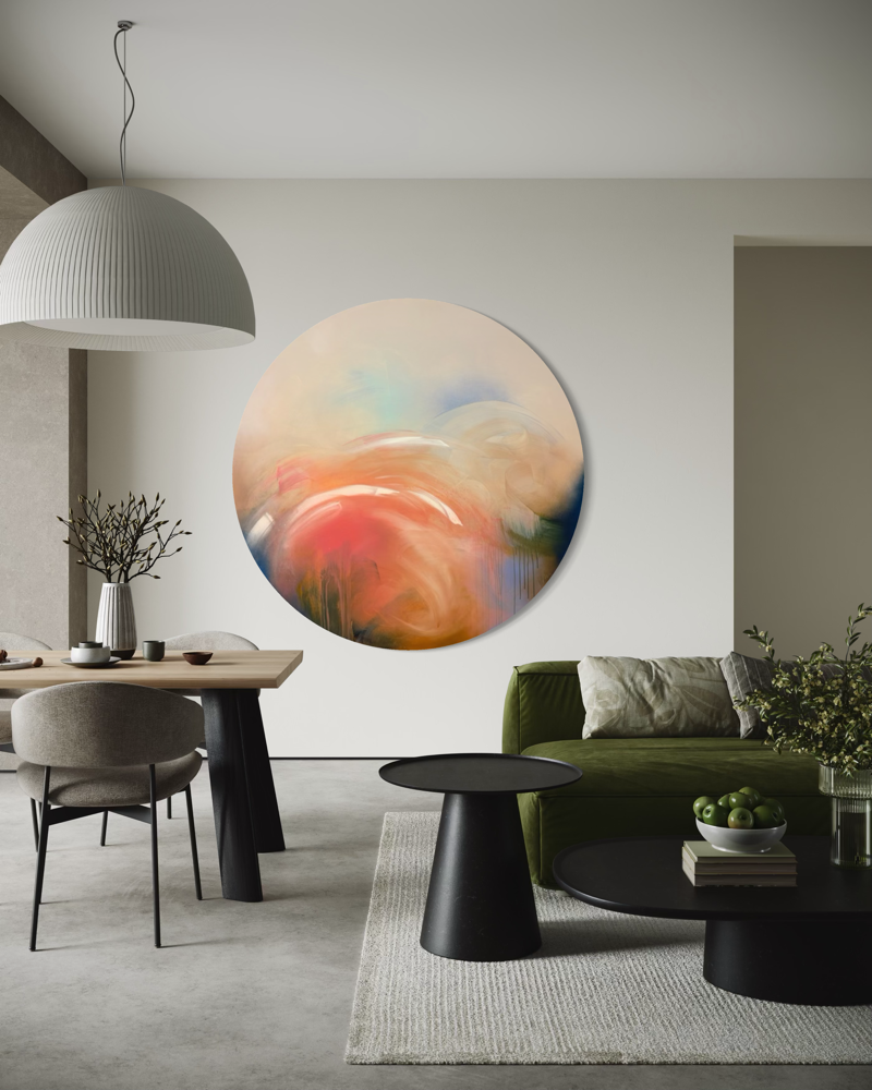 Modern living room with “Count Your Blessings” by Kate Mayer above a green sofa, dining table, and minimalist decor.
