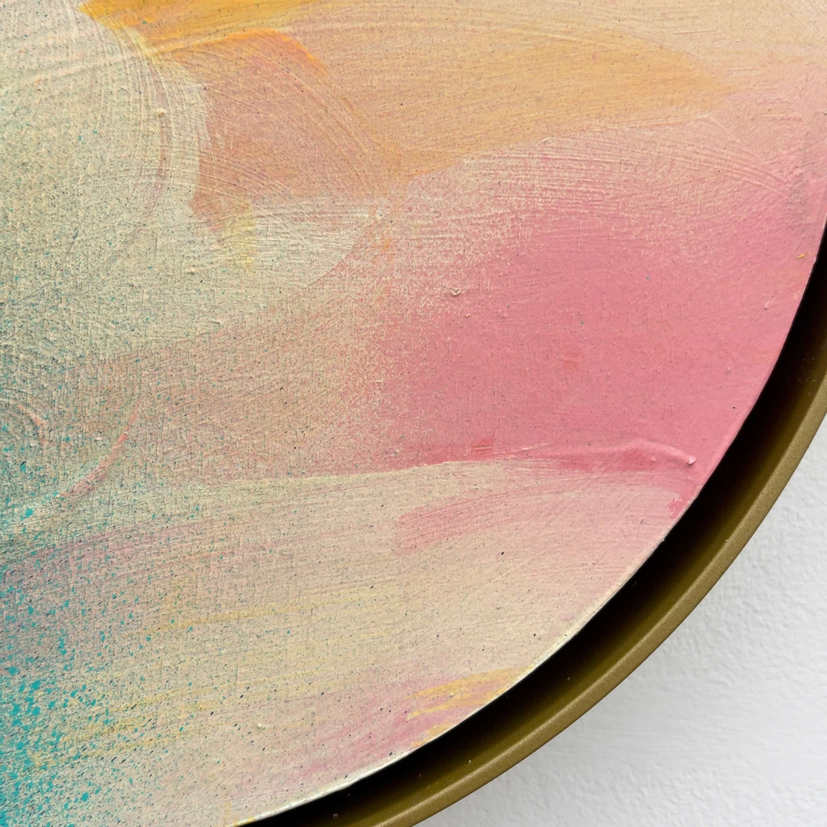 Close-up of “Brighter Day” by Kate Mayer, abstract pastels in a handmade metal float frame with a gold edge.