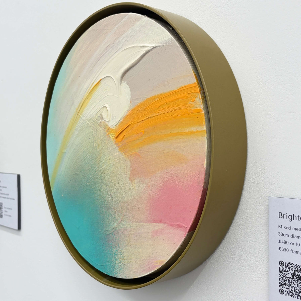Brighter Day by Kate Mayer: circular abstract acrylic on plywood with pastel swirls in a handmade metal float frame.