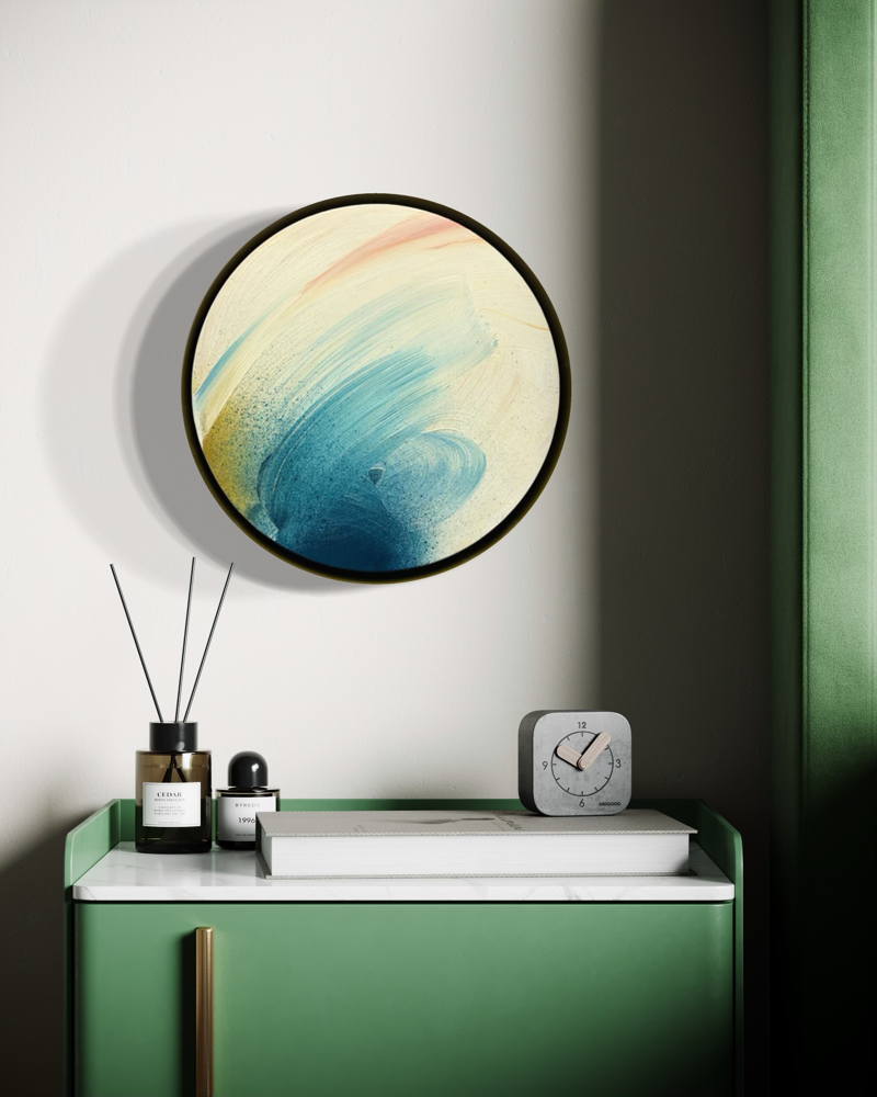Don’t You Every Give Up“ by Kate Mayer in a handmade float frame, above a green cabinet with perfume and a clock.