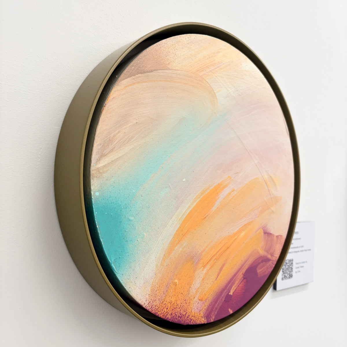 Good Times by Kate Mayer: Round acrylic on plywood in metal float frame, pastel hues, displayed on white wall.