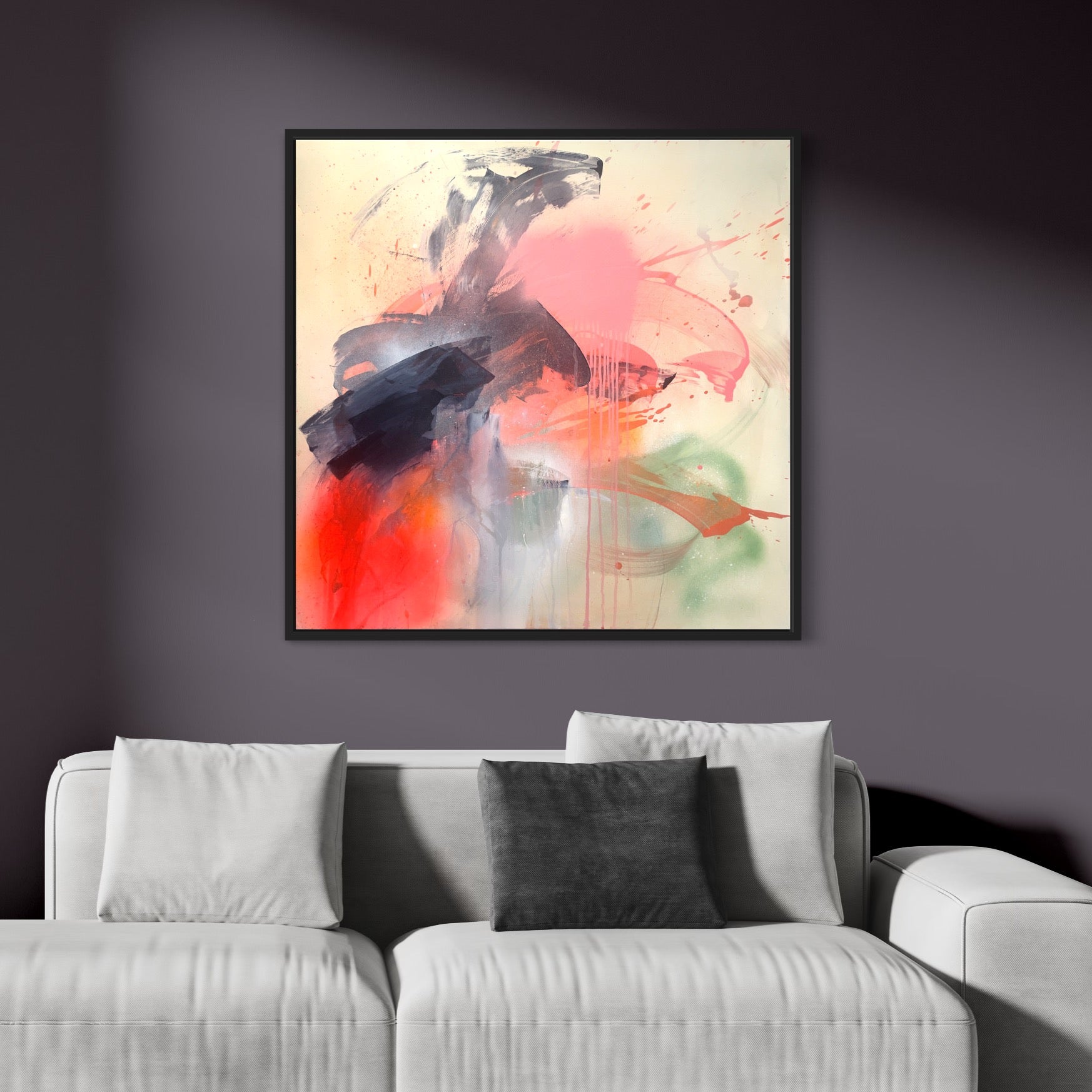 Titled "Fire And Ice," this original painting by Kate Mayer, crafted with acrylic on canvas, showcases vibrant splashes of pink, orange, and dark tones. It brings an elegant touch to the wall above a white sofa adorned with two white cushions and one gray cushion.