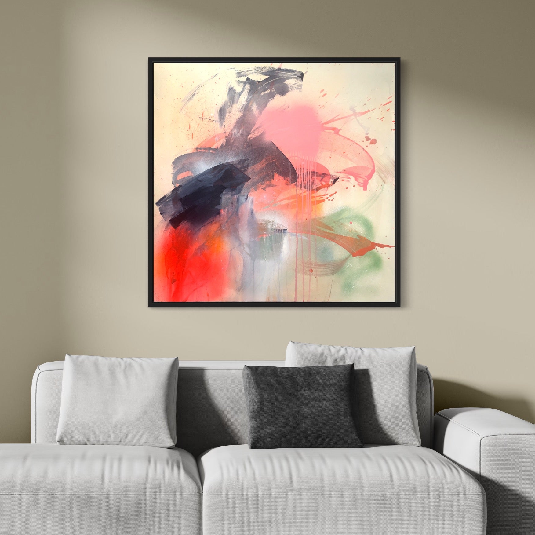 The painting "Fire And Ice - Original Painting" by Kate Mayer features bold red and black brushstrokes on a light background, elegantly displayed above a white sofa with gray cushions.