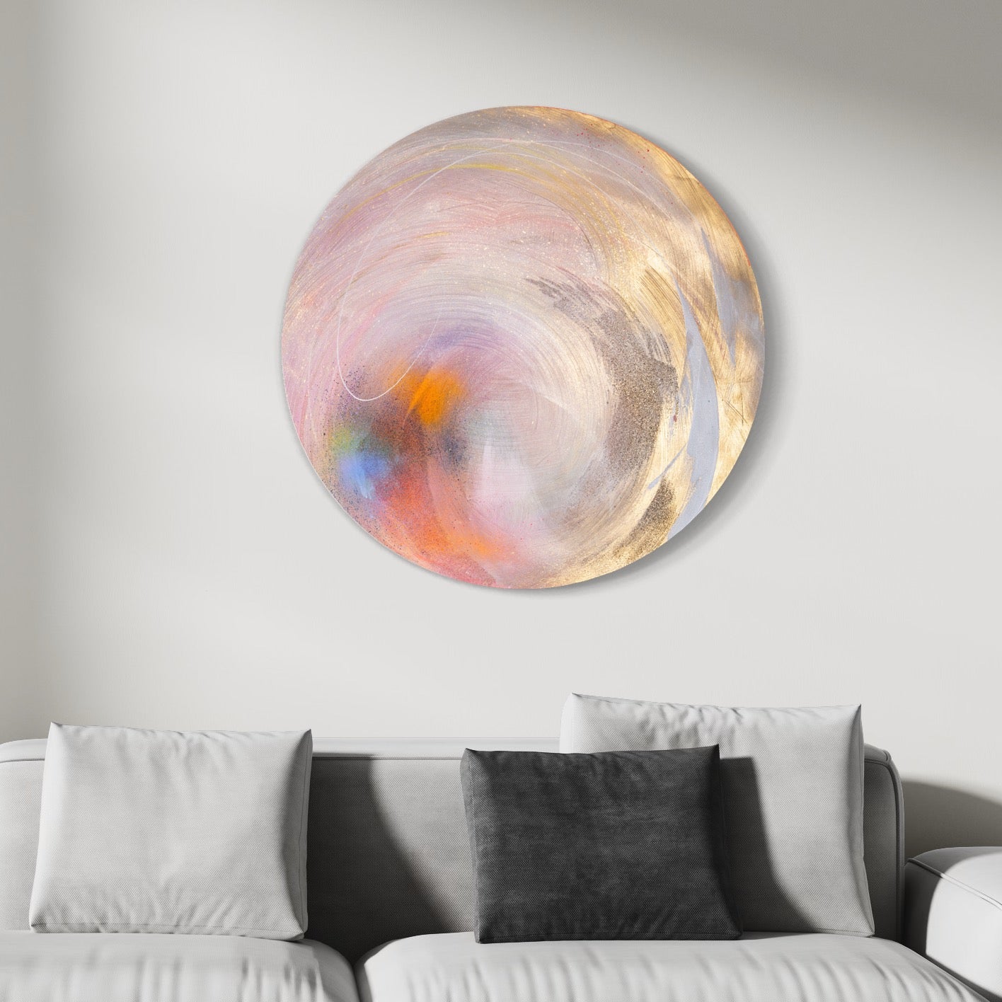 Believe In Me" by Kate Mayer, an original painting showcasing swirling pastel colors and hints of Diamond Dust, hangs above a white sofa decorated with three cushions.