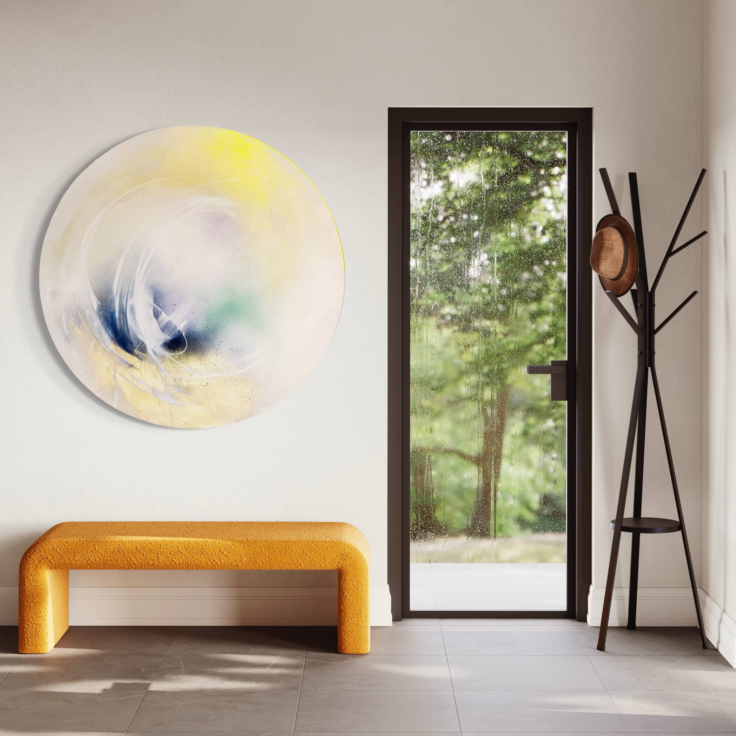 A minimalist entryway showcases the "Let's Make This Moment Last" original painting by Kate Mayer, bursting with vibrancy in acrylic and spray paint. It pairs beautifully with a yellow bench and complements a black door featuring a window, along with a coat rack adorned with hats.