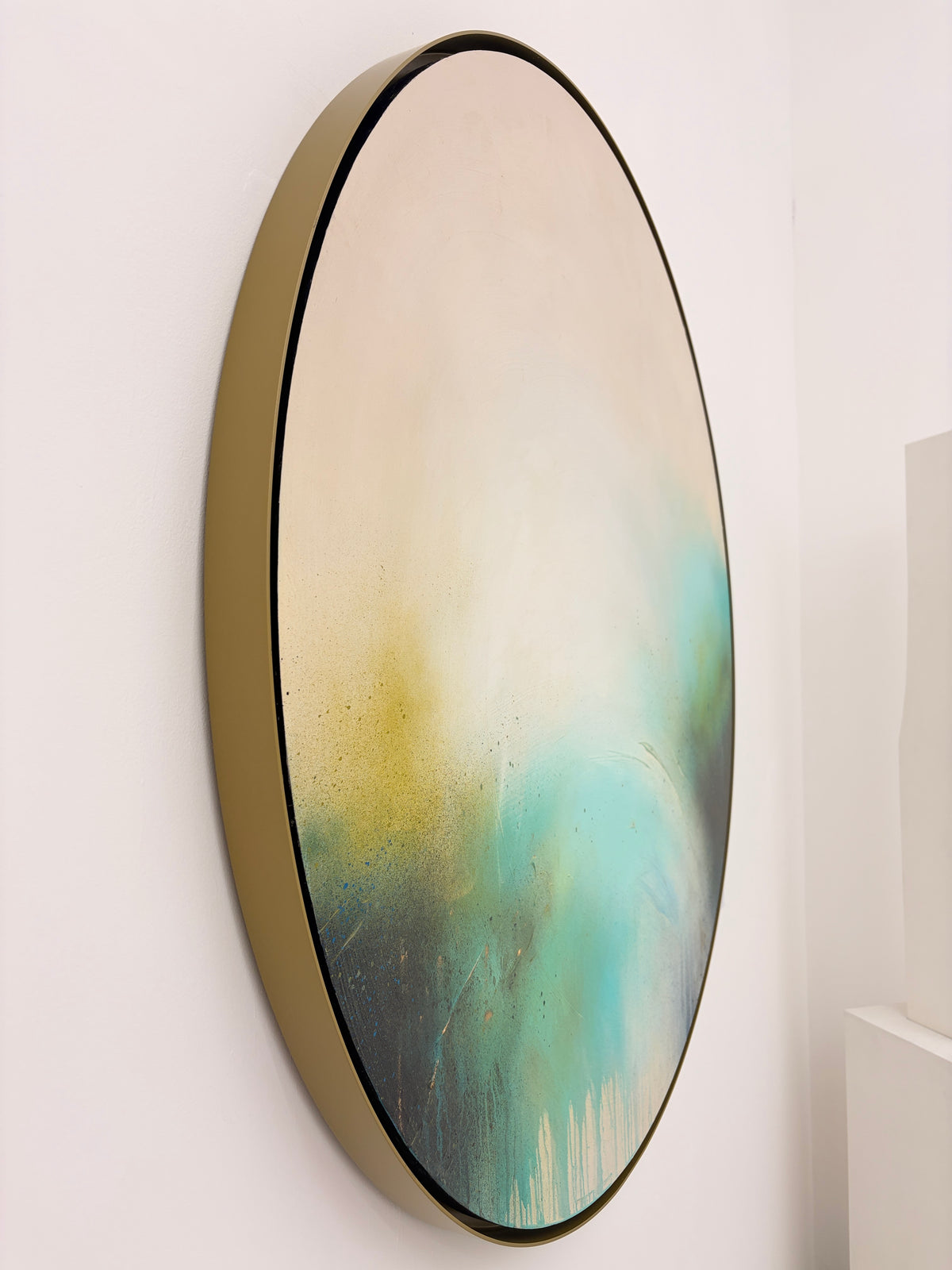 Side view of “The Afterglow of Stillness” by Kate Mayer, acrylic on plywood in soft beige, green, blue, and yellow.
