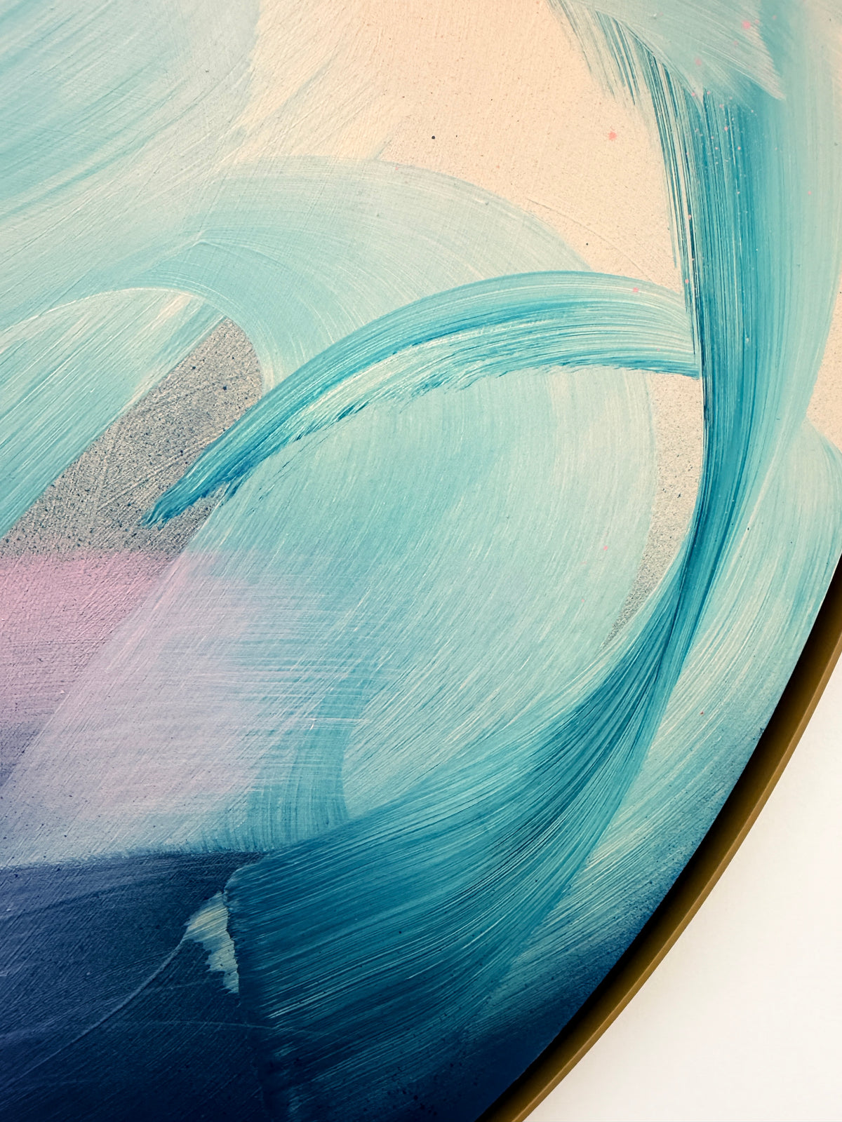 For Every Mountain by Kate Mayer: sweeping turquoise and blue on round canvas, set in a handmade metal float frame.