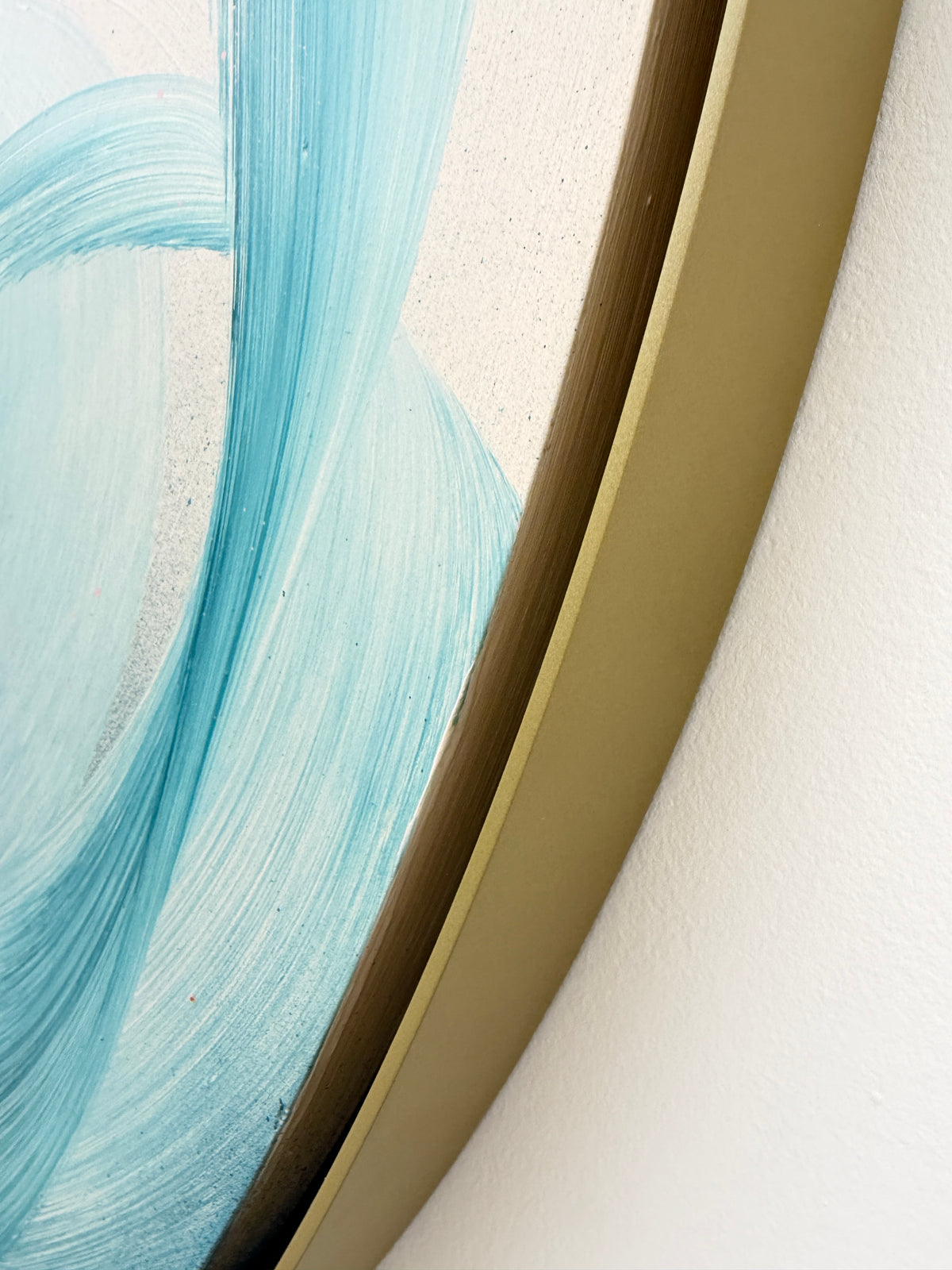 Close-up of “For Every Mountain” by Kate Mayer, blue abstract brushstrokes on canvas in a handmade metal frame.