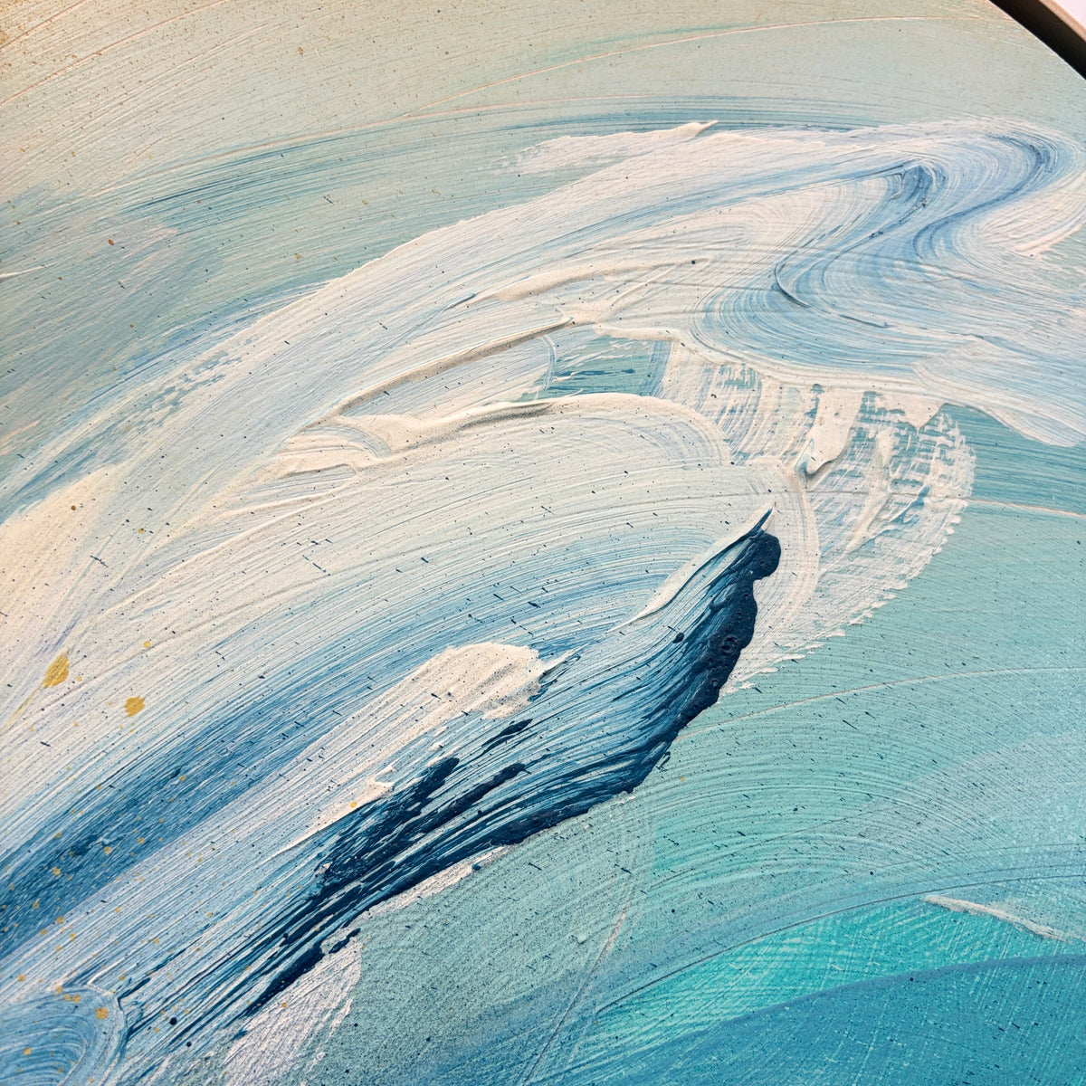 Kate Mayer’s “As” features abstract blue and white acrylic brushstrokes on textured plywood, evoking waves or clouds.