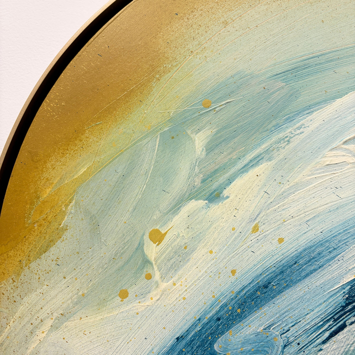 As“ by Kate Mayer: Abstract gold, blue & white swirls on curved canvas in a handmade metal frame.