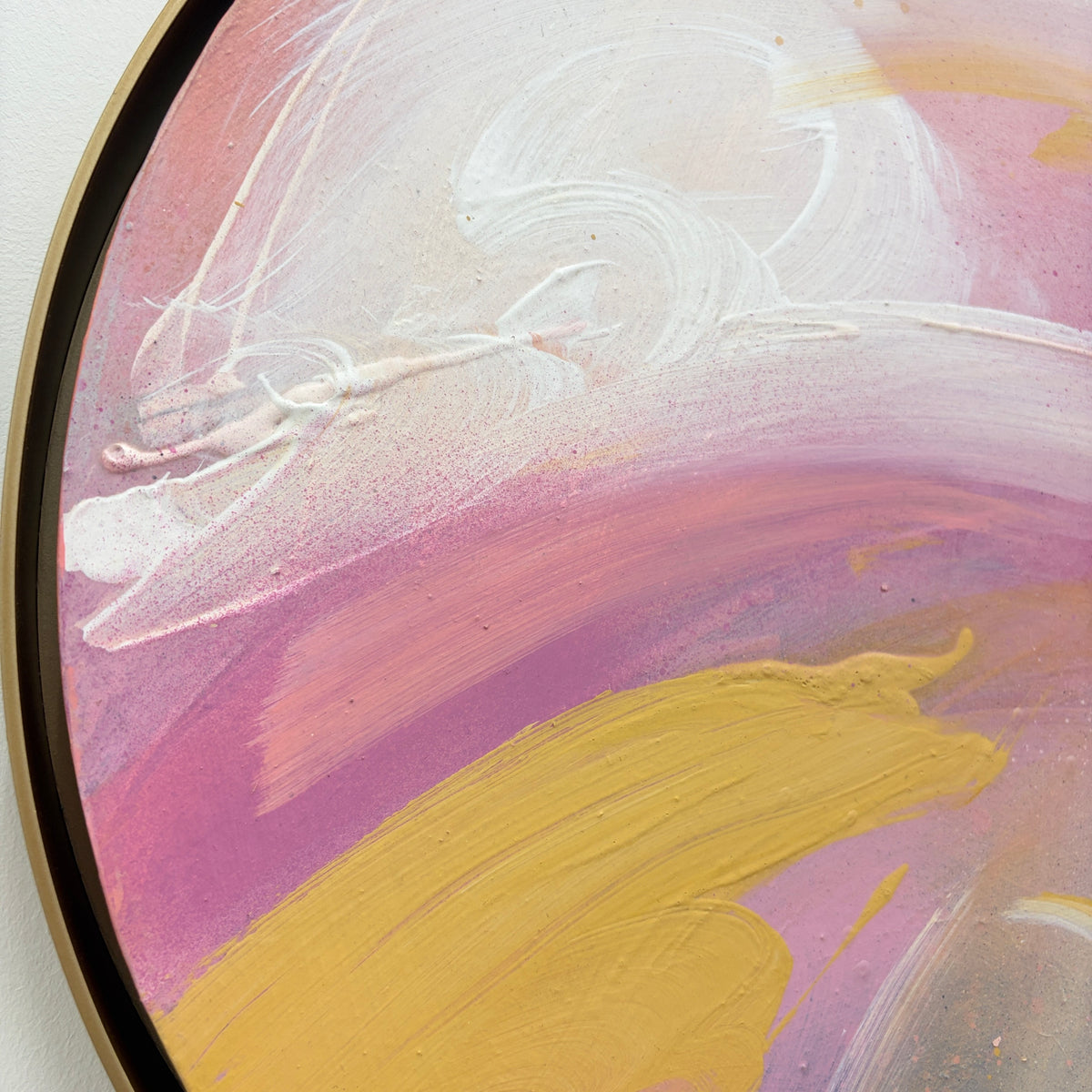 Love’s In Need Of Love Today“ by Kate Mayer: abstract pink, yellow, white painting in a round metal frame.