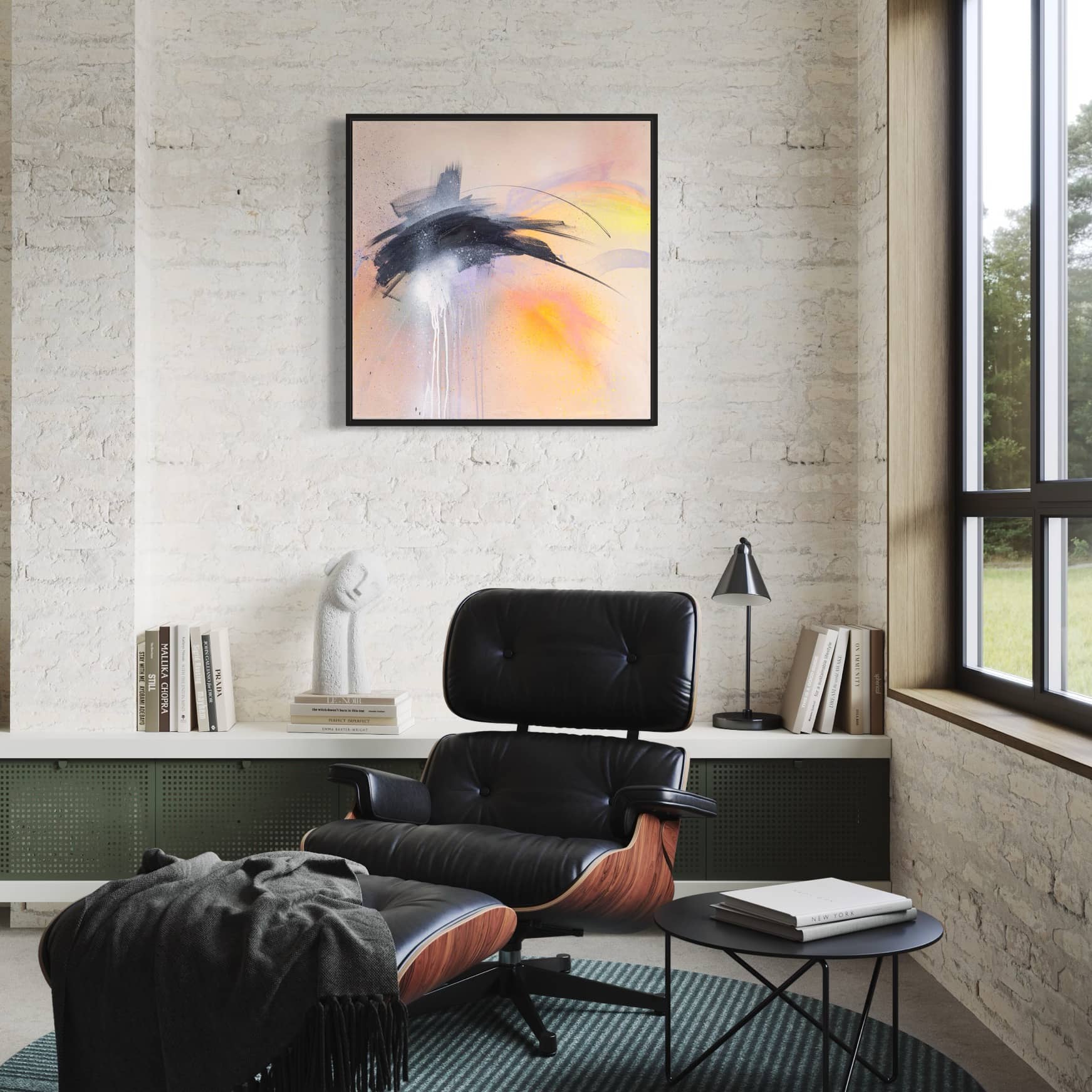 A modern chair and ottoman with a black cushion and wooden frame sit elegantly in a stylish living room, featuring "That Moment On Black Sand Beach" painting by Kate Mayer, done in acrylic and spray paint. The space is accented by abstract art and green views from the window.