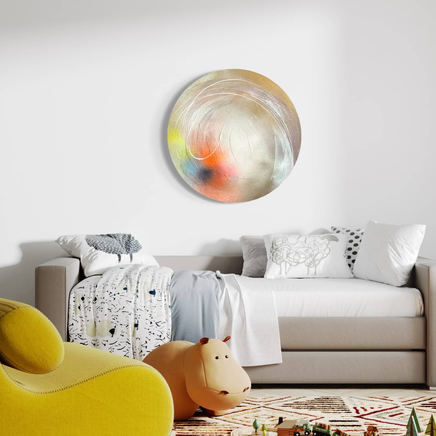 A cozy room featuring a sofa bed, "The Time Is Now" original painting by Kate Mayer adorned with acrylic diamond dust, a yellow chair, and a hippo plush toy on a patterned rug.