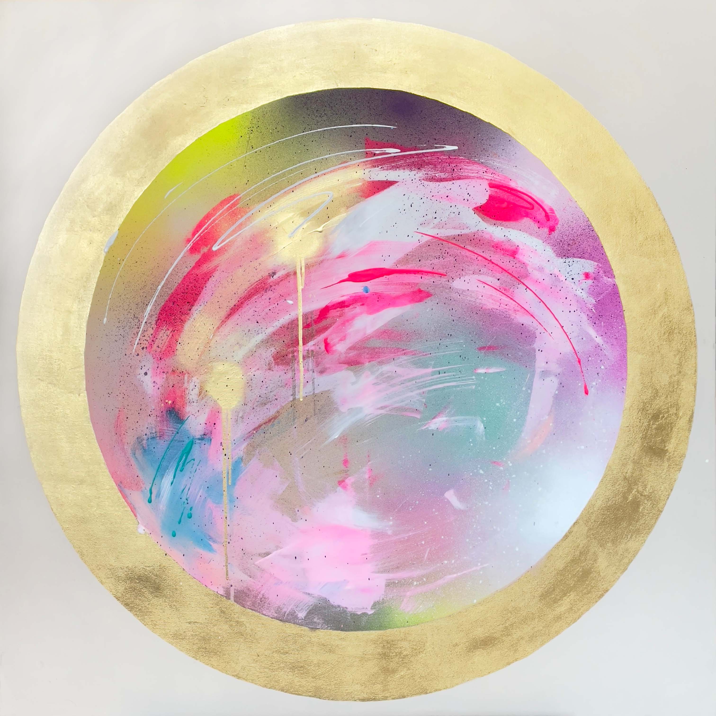 The "Infinite Possibility" by Kate Mayer is a circular abstract painting that features a gold leaf outer ring with vibrant swirls of pink, purple, yellow, and white at the center. It comes ready to hang.