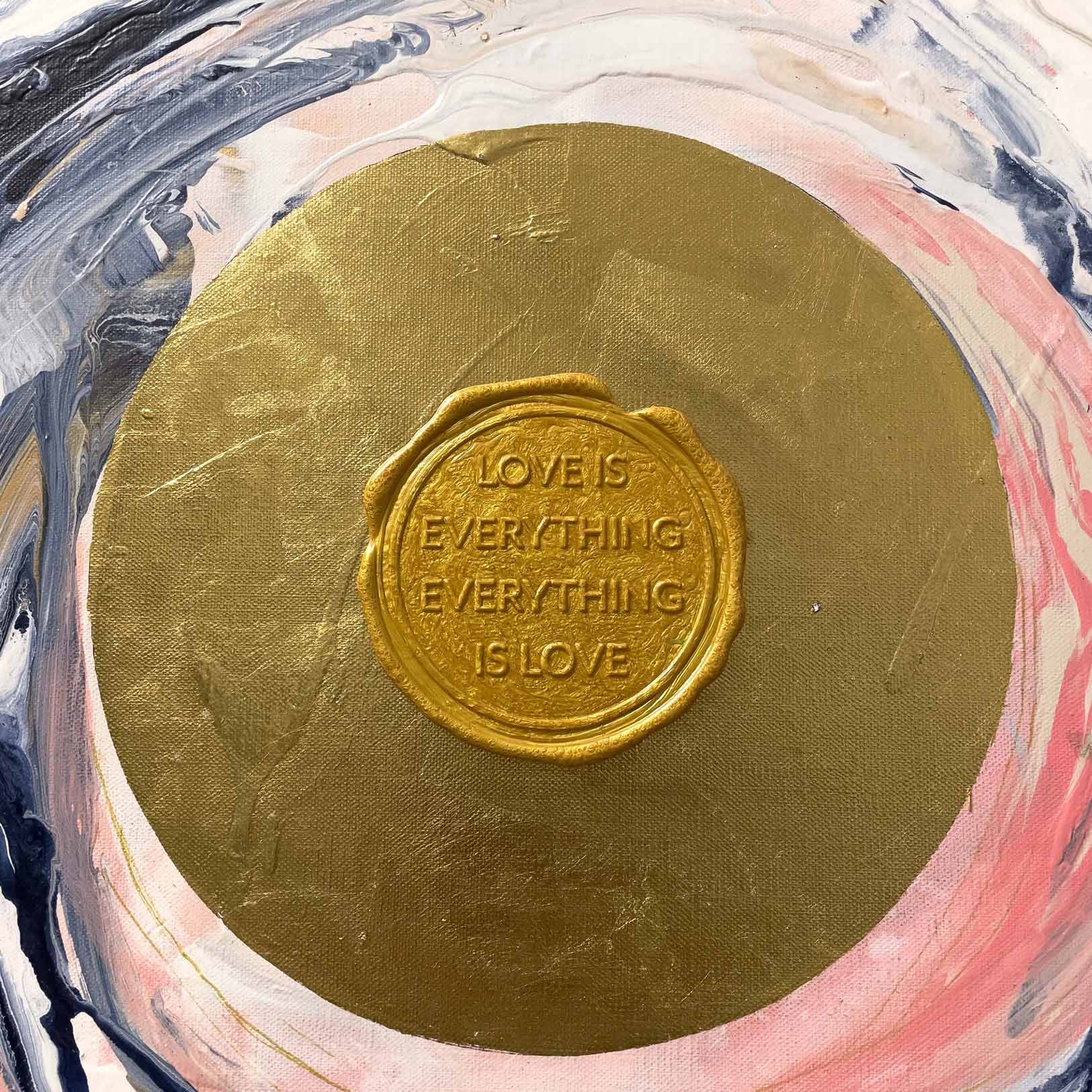 Love Sublime, an original painting by Kate Mayer, features a golden circle embossed with the words 'LOVE IS EVERYTHING, EVERYTHING IS LOVE' against a mesmerizing background of swirling pink, gray, and white. Created using acrylic and gold leaf, this artwork offers an enchanting visual experience.