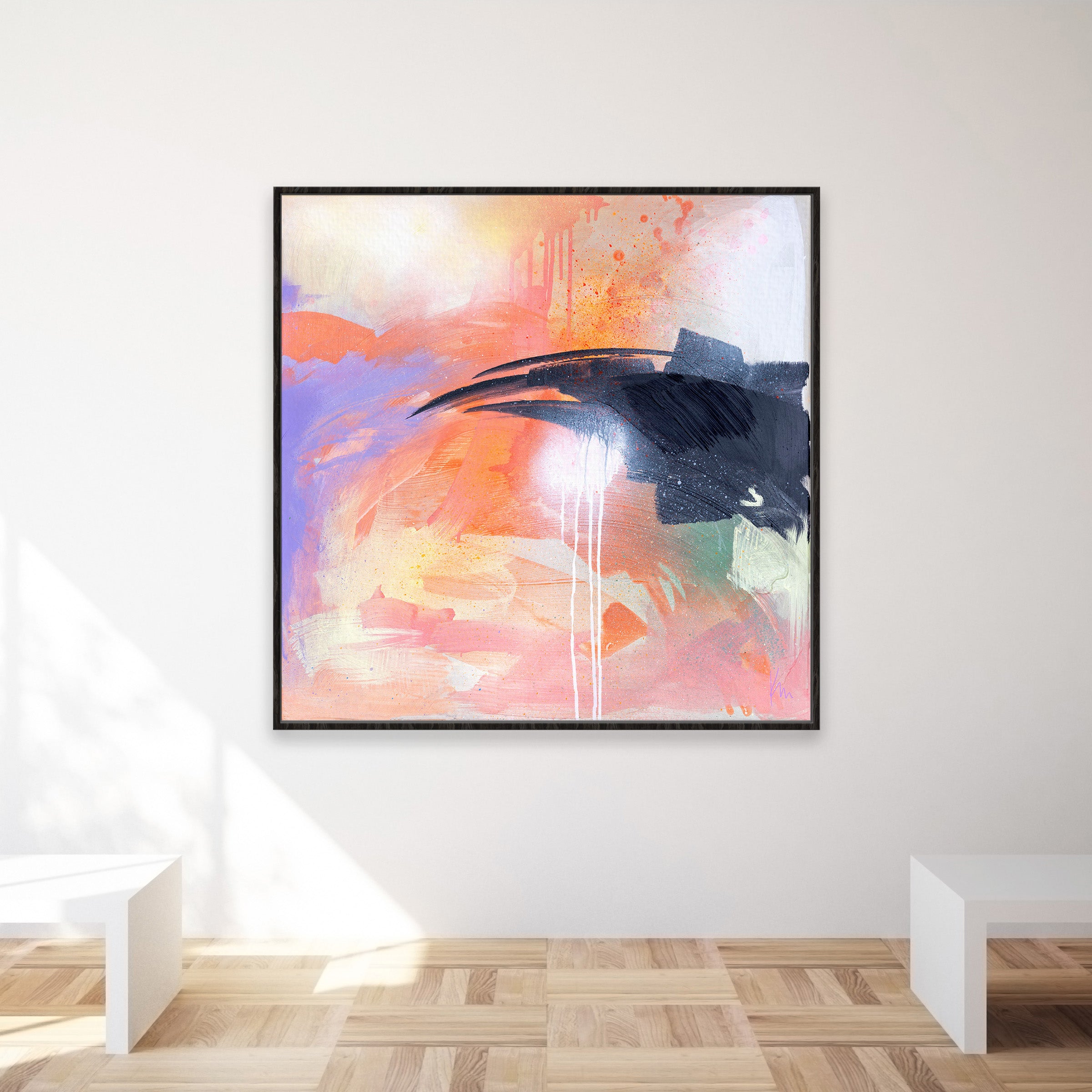 The artwork "Beneath The Surface" by Kate Mayer, showcasing abstract pastel colors, complements a minimalist room with wooden floors and white benches.