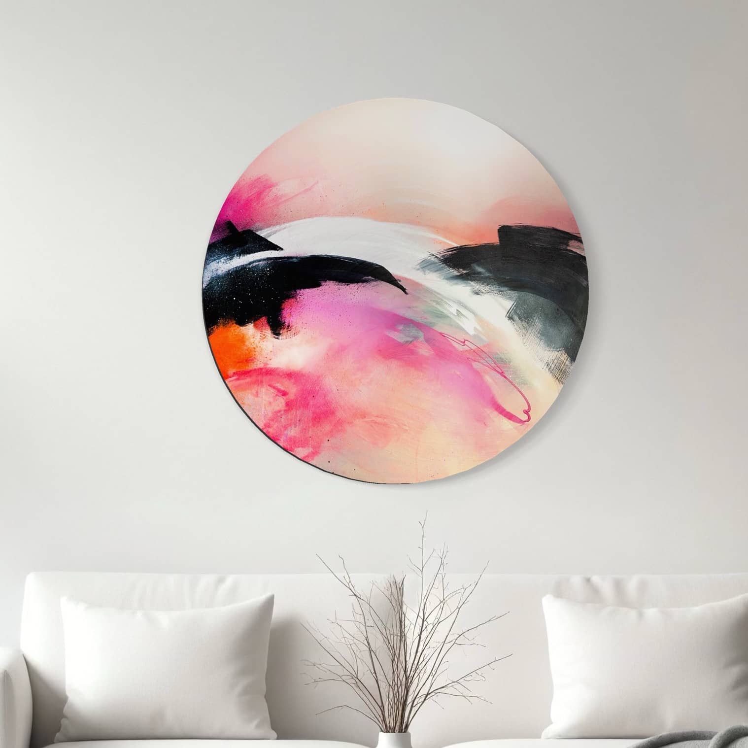 It's A New Dawn" by Kate Mayer, an abstract painting in a handmade frame, hangs above a sofa with a minimalist vase.