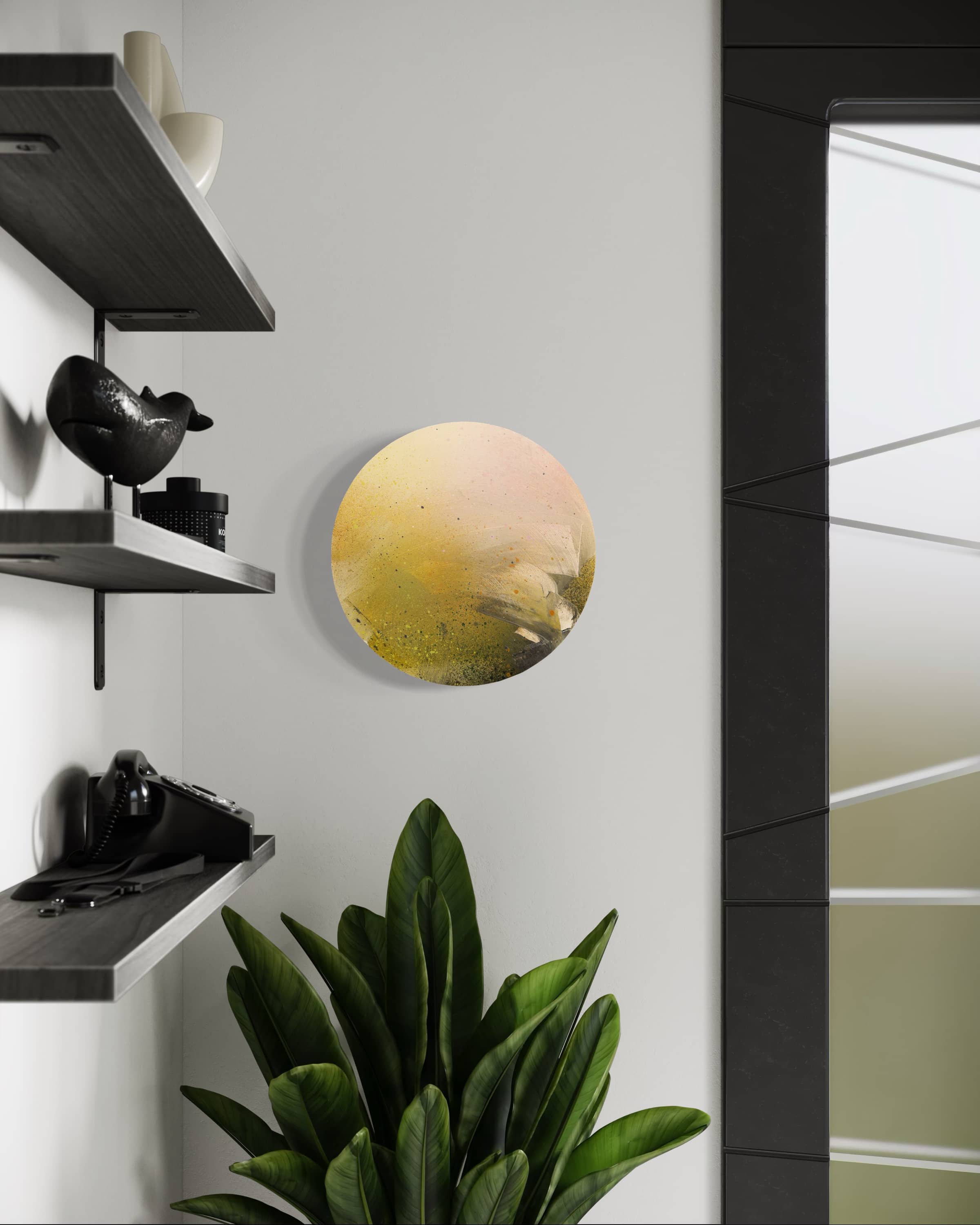 A plant beside a wall featuring the "Everything I Am Is Yours" circular plywood art by Kate Mayer.