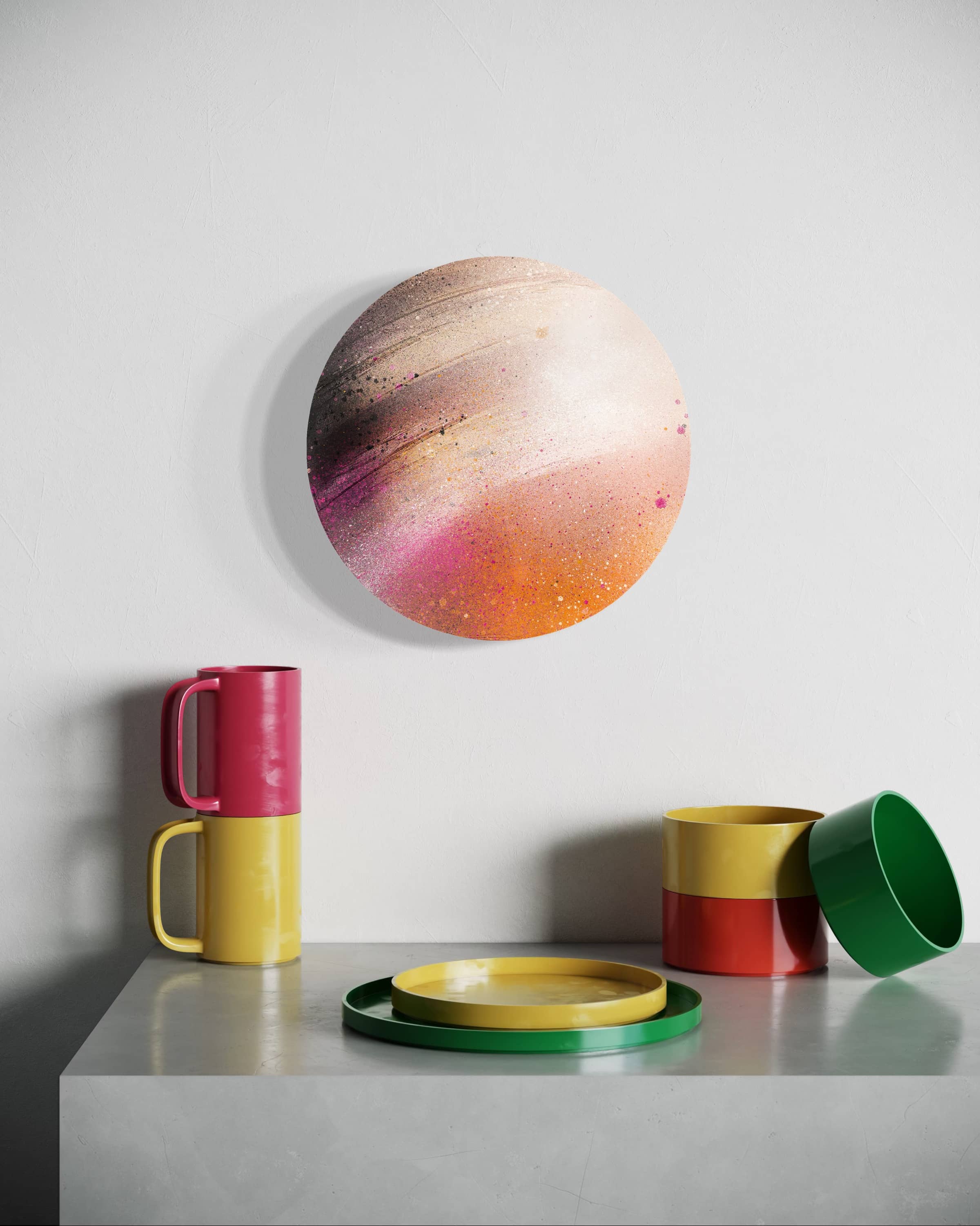 Heaven by Kate Mayer, a colorful abstract painting on circular plywood, hangs above stacked cups and bowls on a gray table.