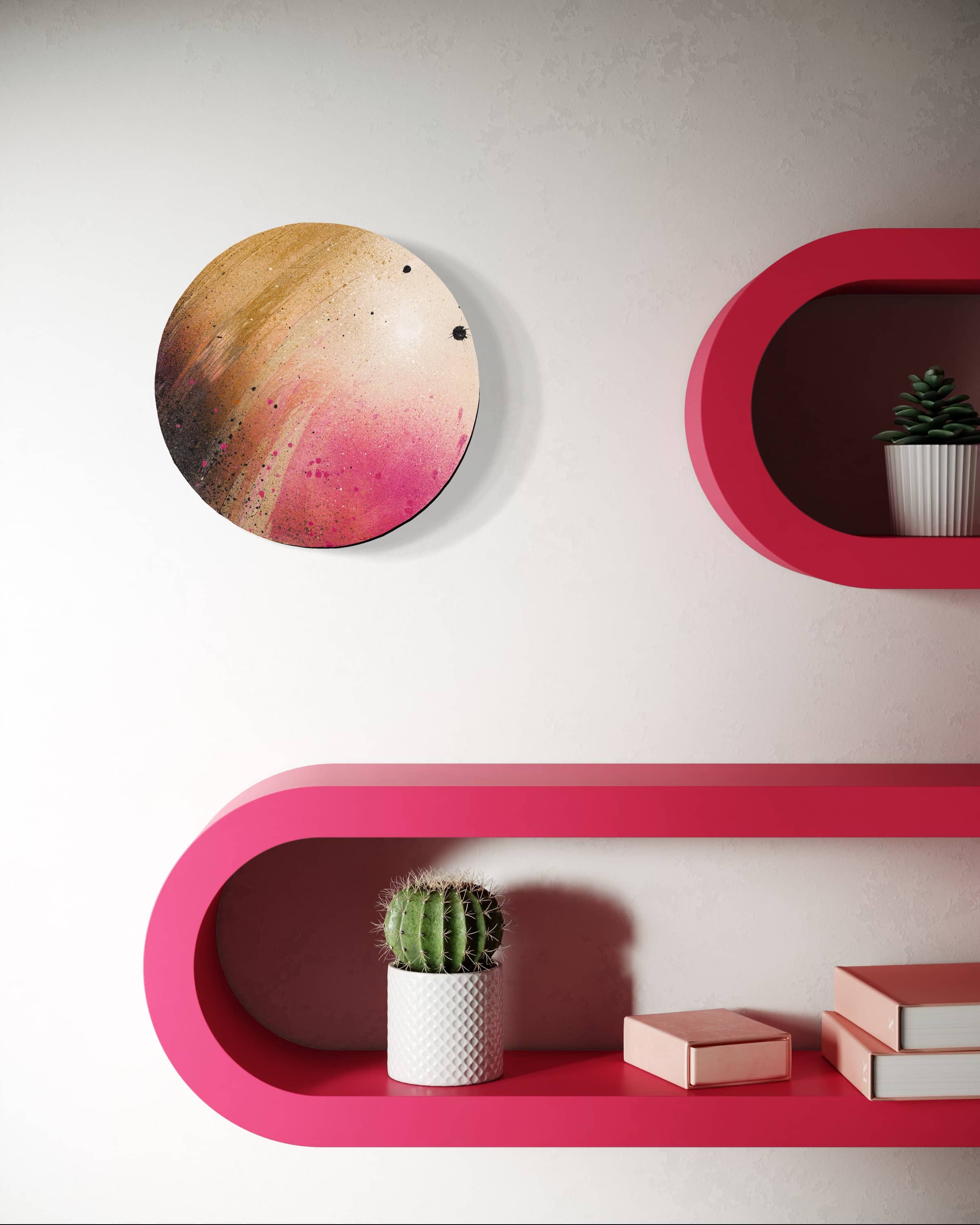 Holocene by Kate Mayer displayed on a white wall above pink shelves with a cactus, books, and plants in white pots.